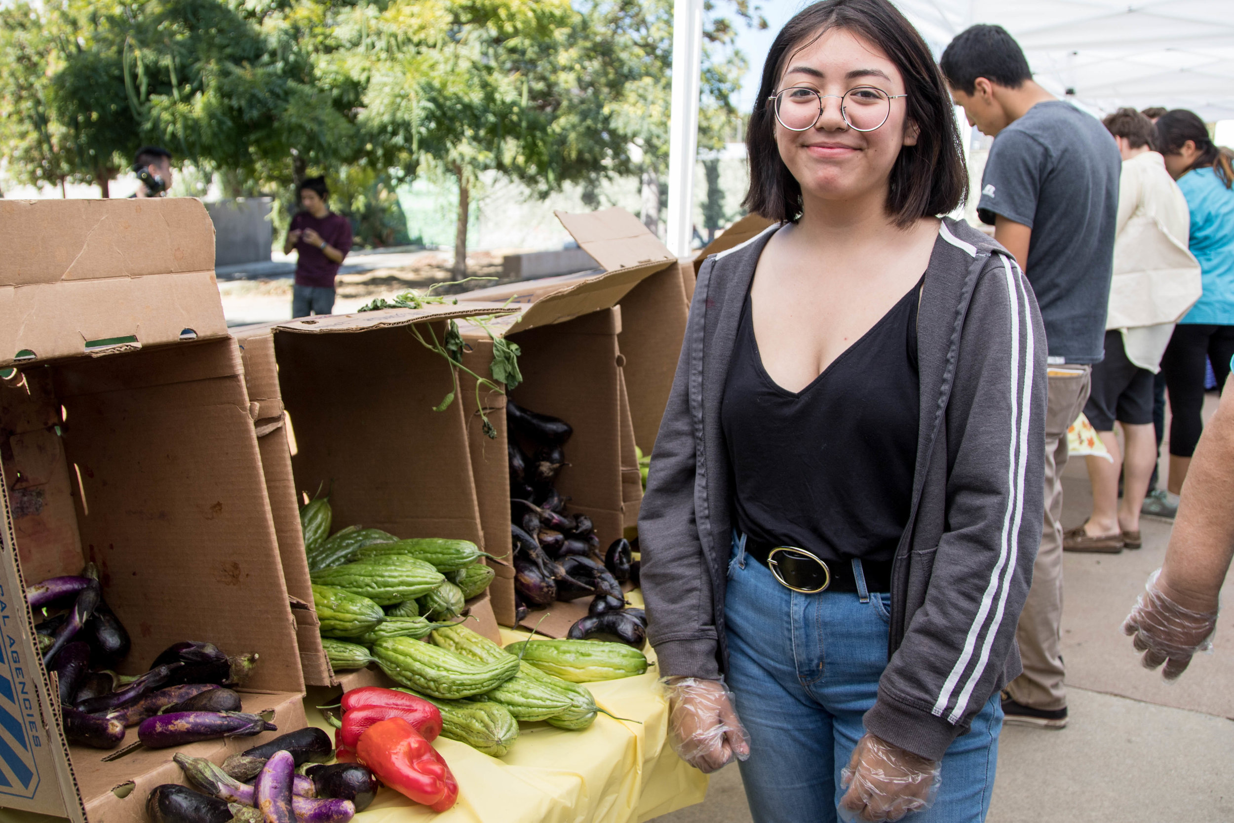  Nattalie Saravia, 18-year old Santa Monica College student and Glub Grow member, volunteers at the Free Corsair Market during Sustainability Week in Santa Monica, Calif. on October 16, 2017. (Photo: Jazz Shademan) 
