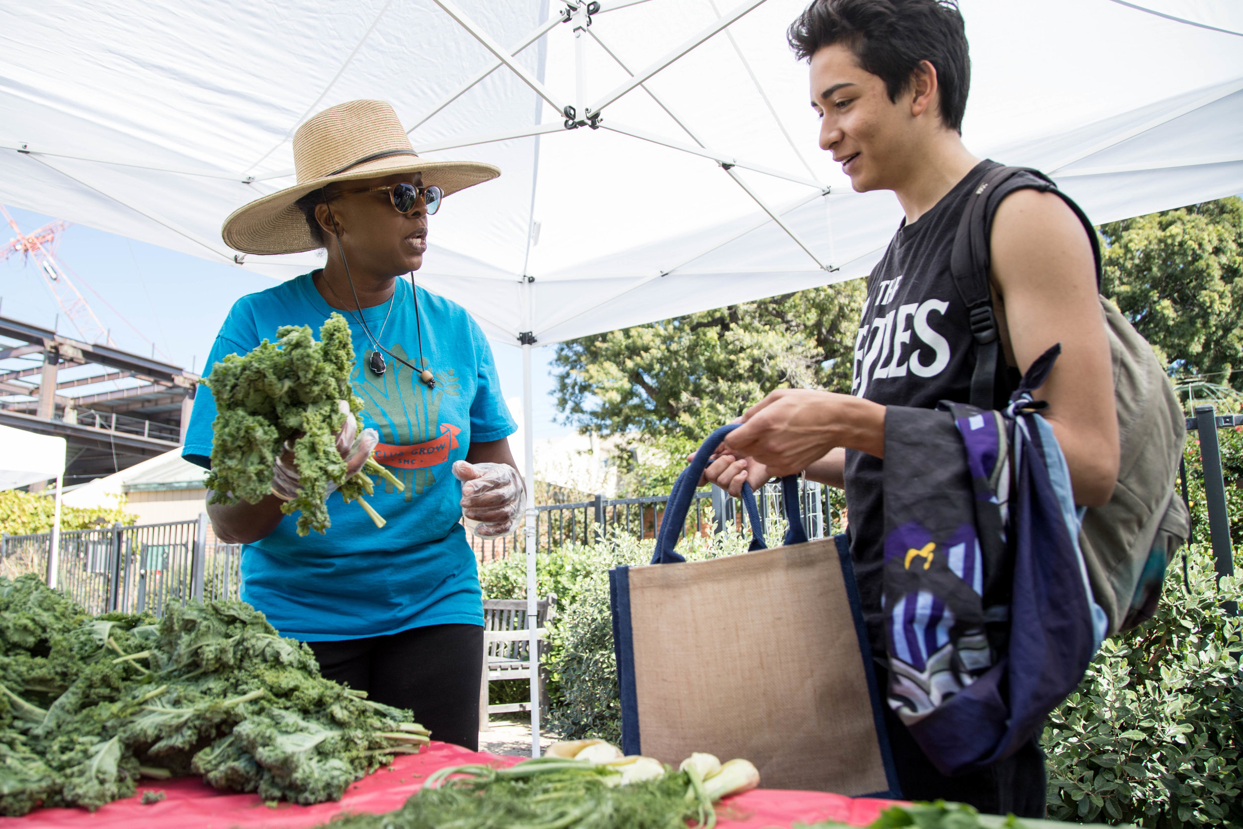 Seventeen year old Santa Monica College student Marco Garcia visits the Free Corsair Farmers Market for the first time on October 16, 2017. He gets advice on how to cook greens from Garden manager Cynthia Kraus during Sustainability Week at SMC in S