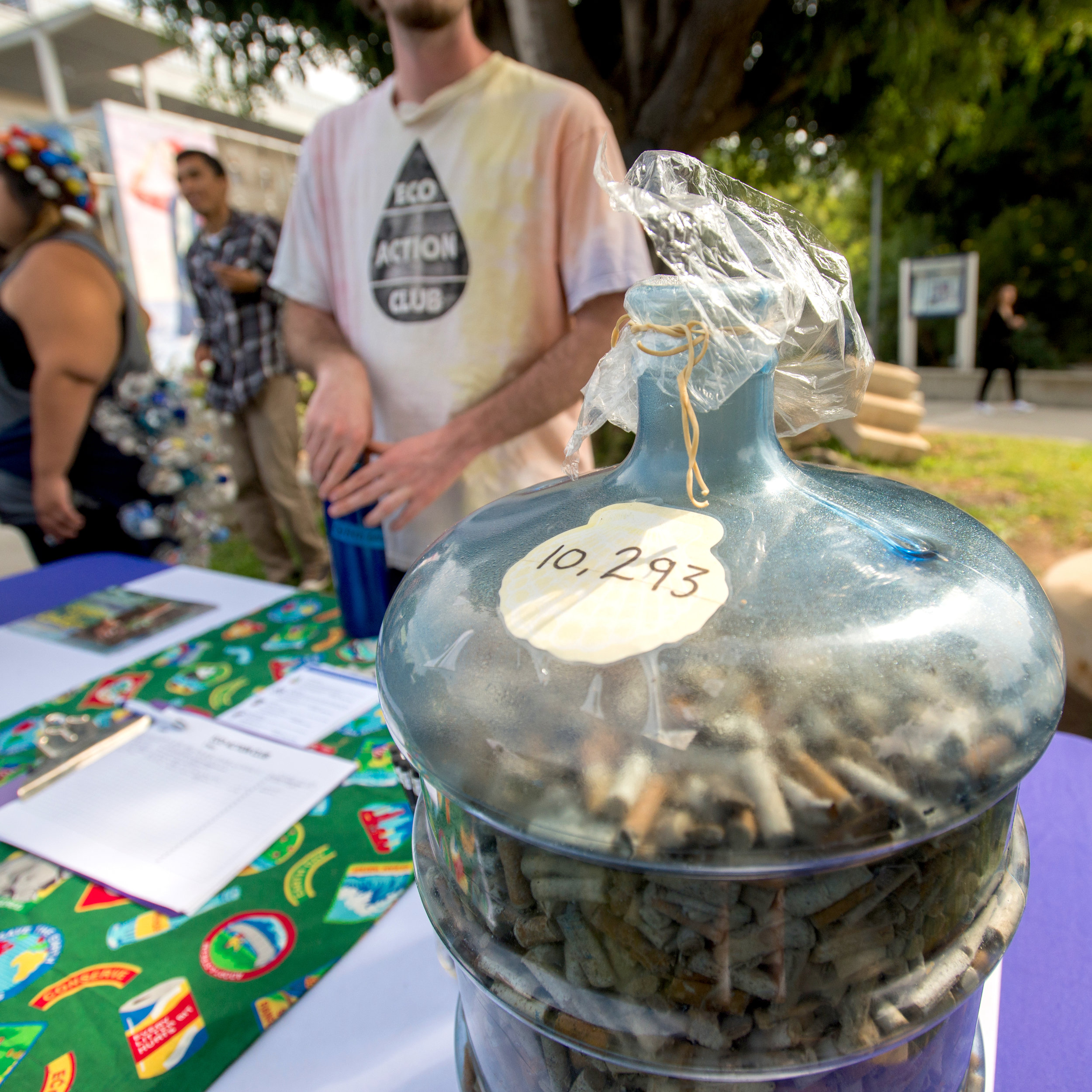  The Eco Action Club displays a water gallon container with the number of cigarette buds filled inside it; which were collected at a beach clean-up, during the Sustainability Week held at Santa Monica College, in Santa Monica, California on October 1