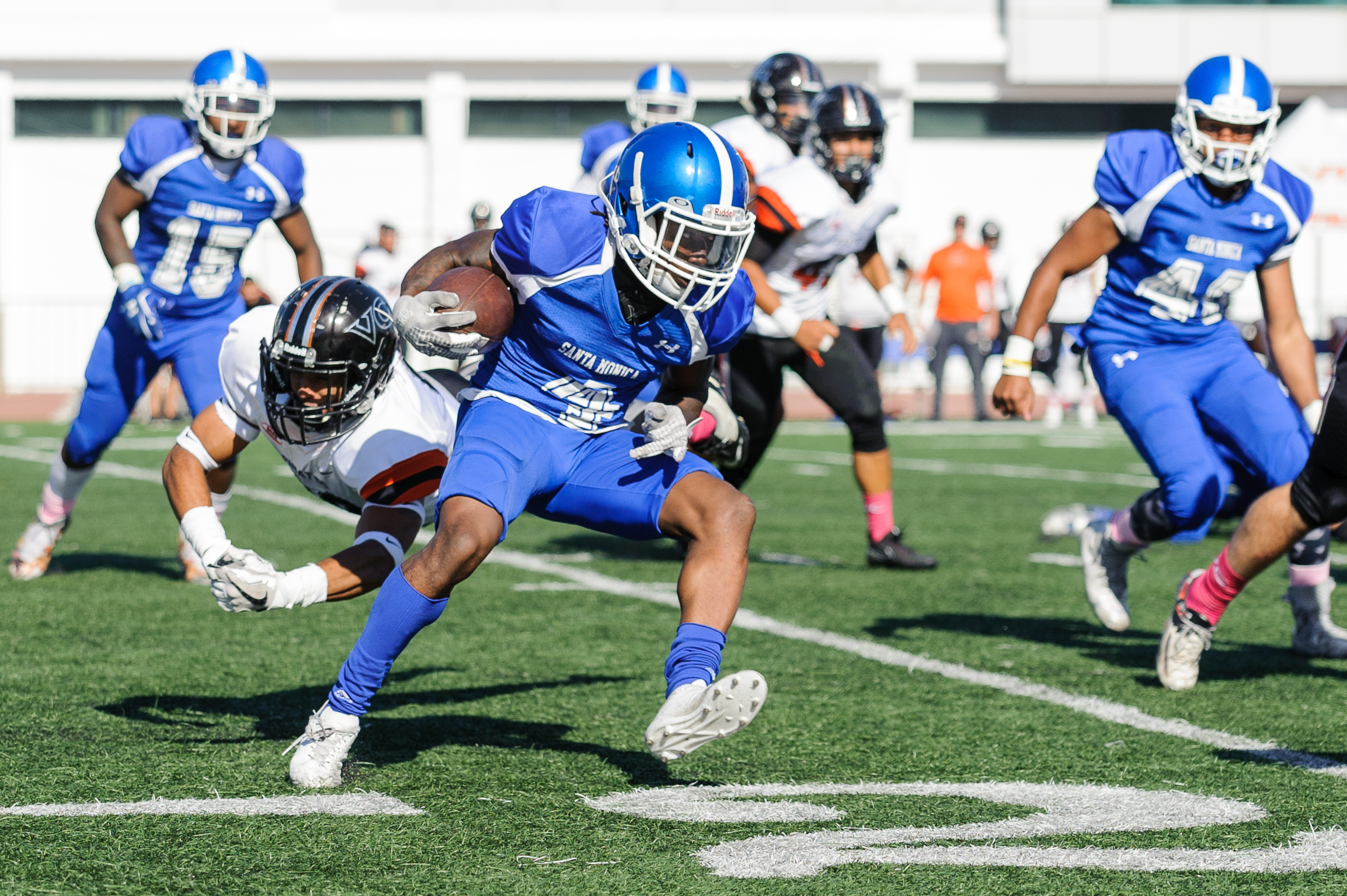  Wide receiver Cristian Franklin (4) of Santa Monica College evades  the Ventura College defense to gain yardage on the play. The Santa Monica College Corsairs lose to the Ventura College Pirates 0-55. The game was held at the Corsair Stadium at the 