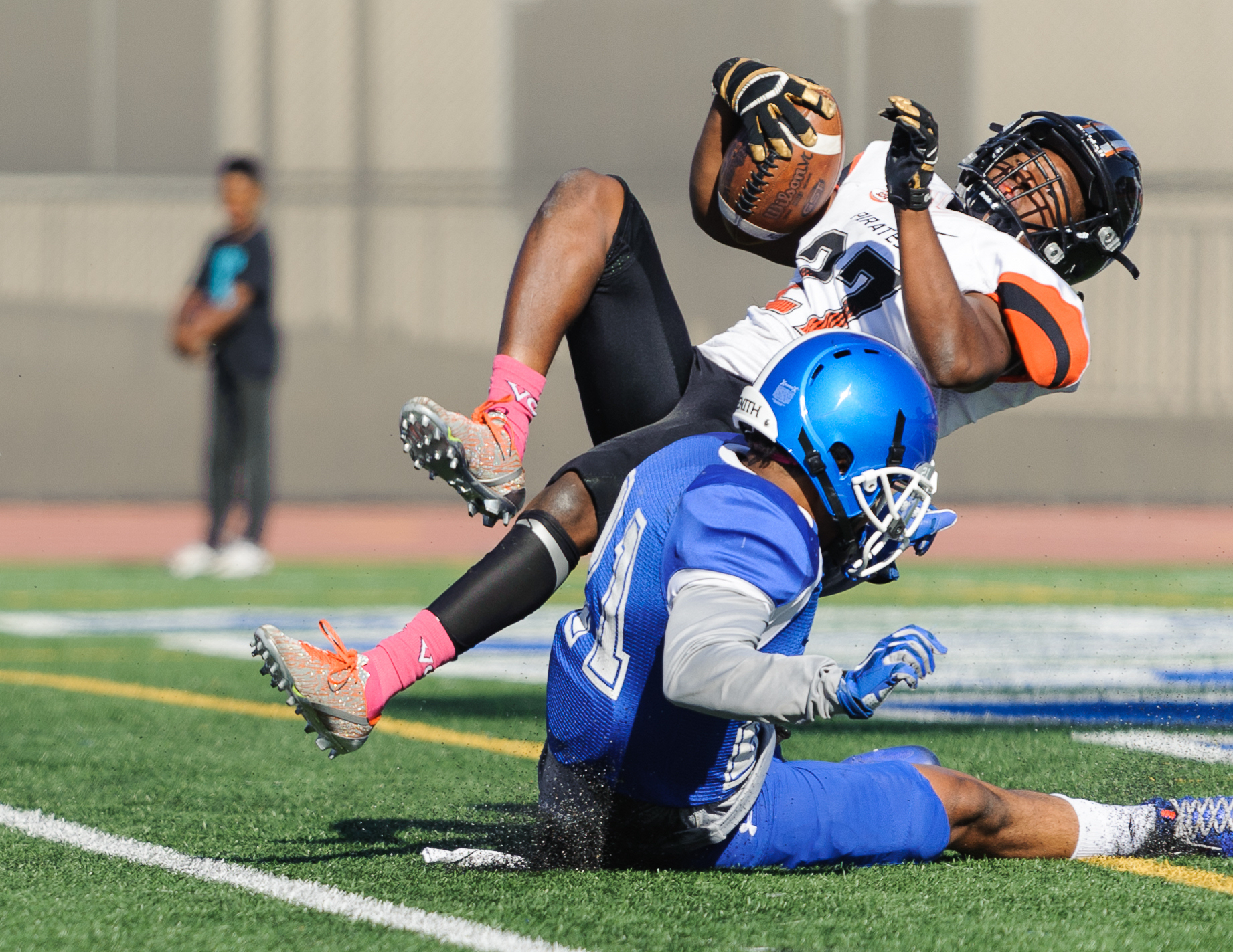  Wide receiver Aveon Irving (27) of Ventura College jumps into the endzone for a touchdown despite being tackled by Skye Germaine (21) of Santa Monica College. The touchdown was later waived off as there was a flag during the play. The Santa Monica C