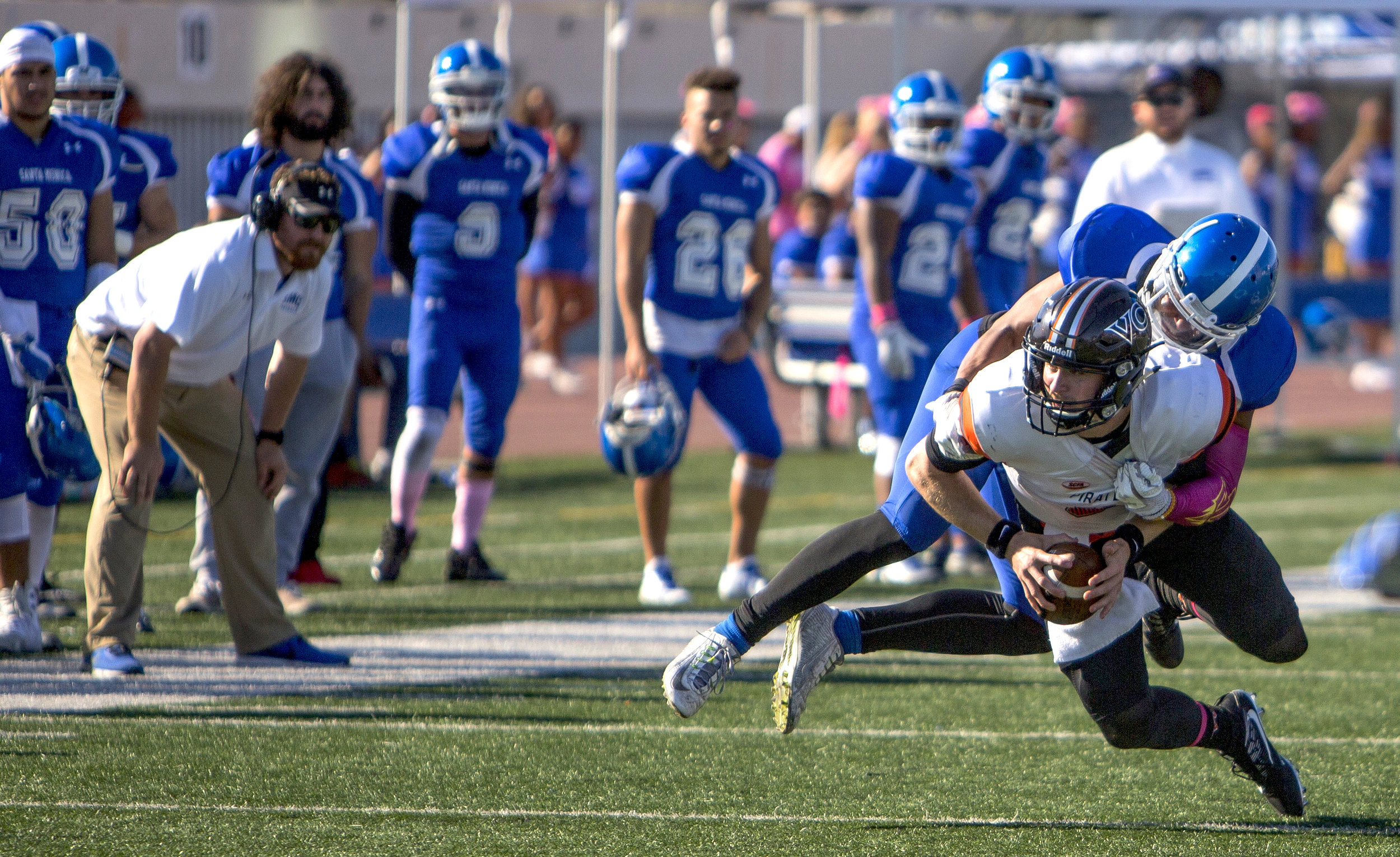  The Santa Monica College Corsairs Mens football linebacker D'Akibba Wallace (3) (blue,left) gets a sack against The Ventura College Pirates quarterback Ricky Town (8) (white,right) , Saturday, October 21st, 2017, at Santa Monica College in Santa Mon