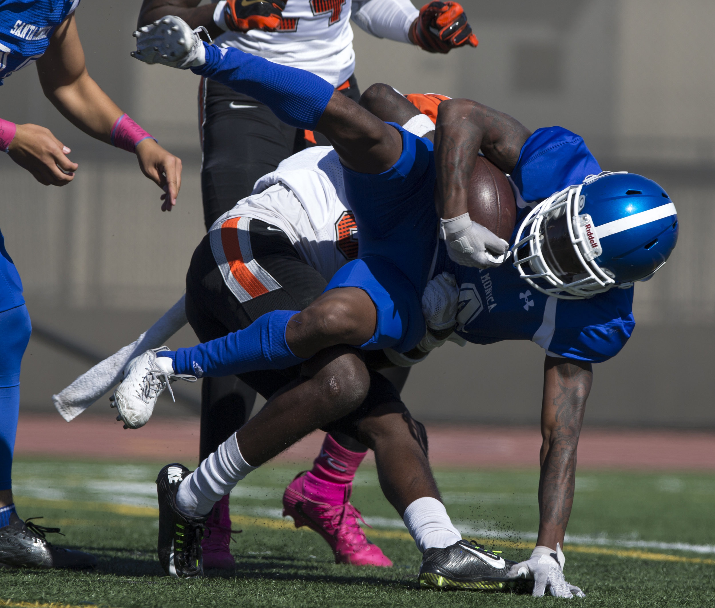  Santa Monica College Corsair wide receiver Franklin Cristian (4) gets tackled by Ventura College Pirate defensive back Jon Hughes (33) on the Corsair Field at Santa Monica College on October 21, 2017 in Santa Monica, California. Corsairs lose to the