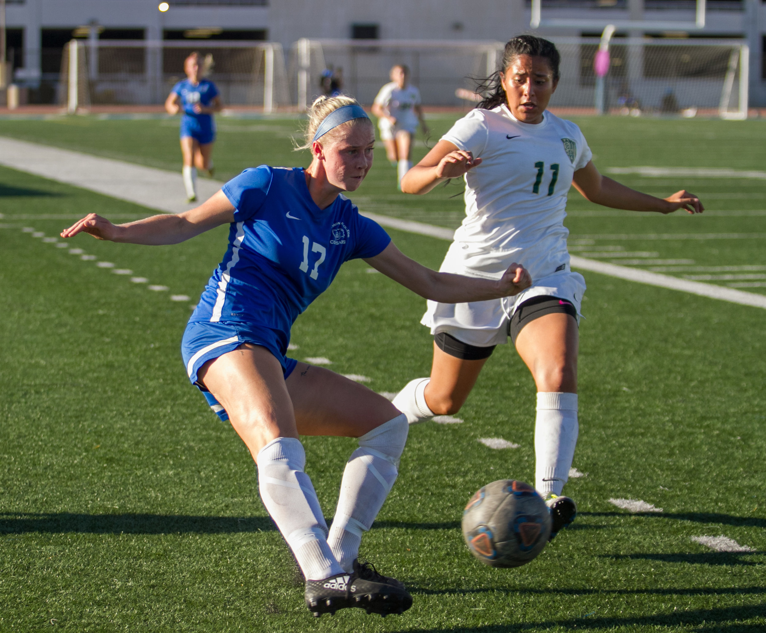  Santa Monica College Corsair Filippa Struxsjo (17)(L) attempts to center the ball while being pressured by LA Valley College Monarch Nathalia Campos (11)(R) on Tuesday, October 24, 2017, on the Corsair Field at Santa Monica College in Santa Monica, 