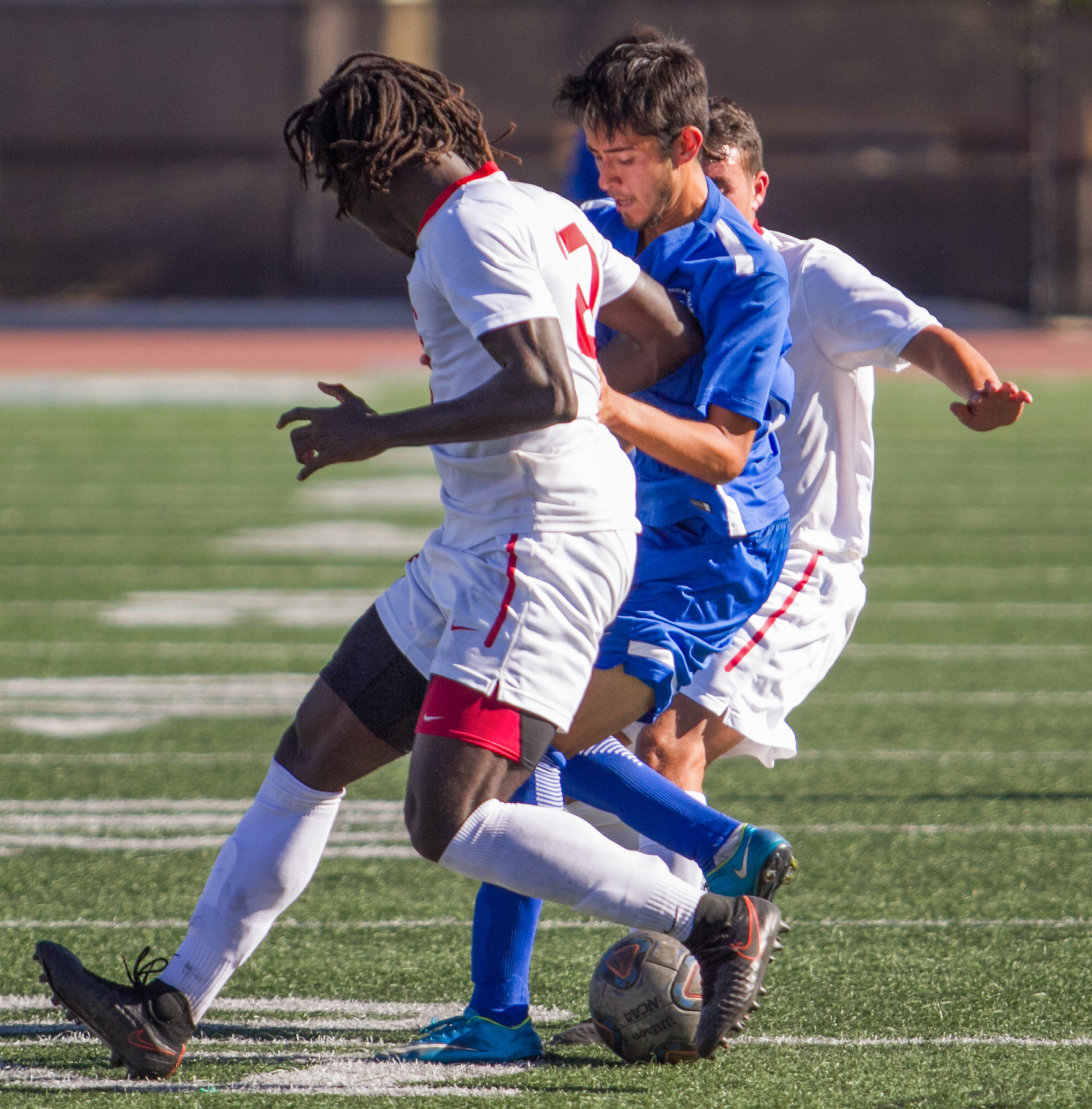  Santa Monica College Corsair Carlos Rincon (16)(CTR) fights for possession of the ball against Santa Barbara City College Vaqueros Hudson Handel (27)(L) and Jessie Jimenez (8)(R) on Tuesday, October 24, 2017, on the Corsair Field at Santa Monica Col