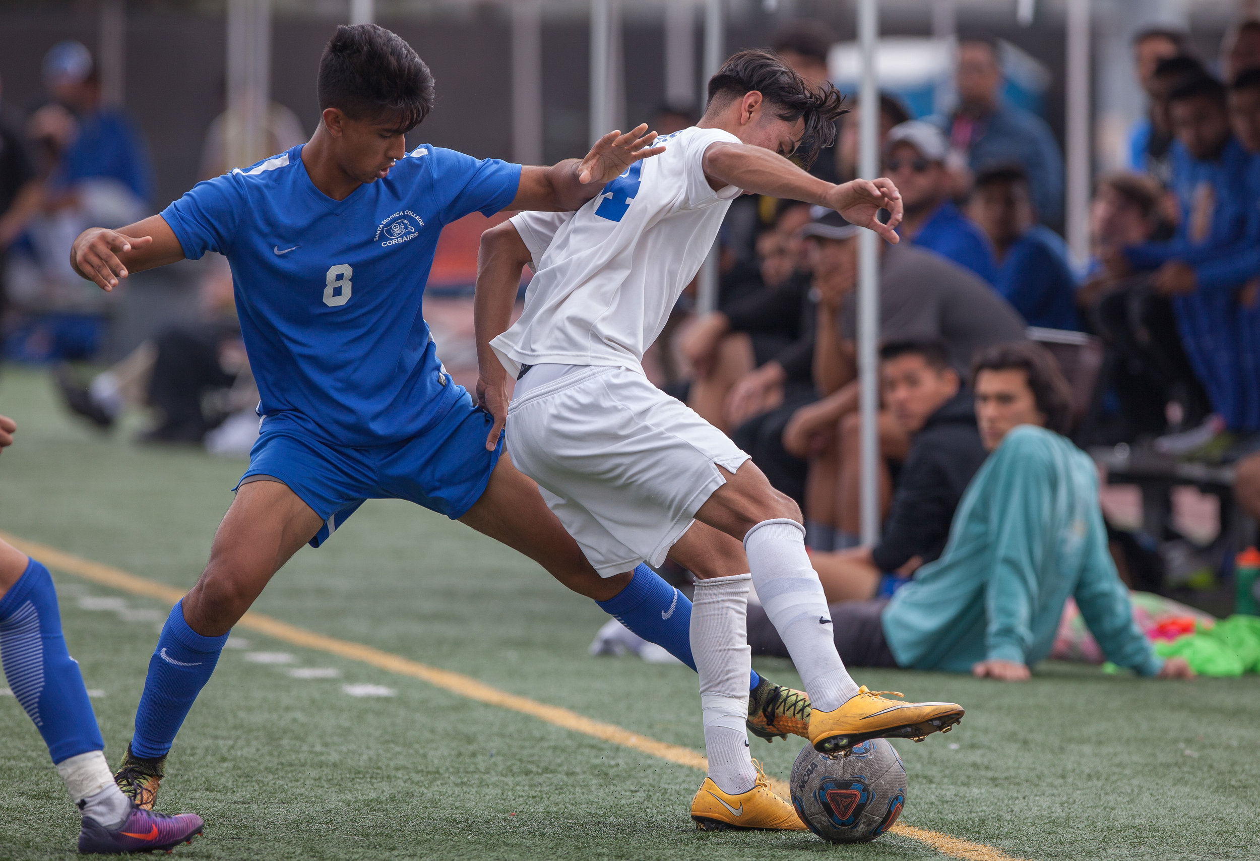  Andy Naidu (8) of the Santa Monica College to withdraw the ball from Eric Pulido (14) of the  Allan Hancock College. The game ended 1-1 resulting in a tie. The game was held at the Corsair Stadium at the Santa Monica College Main Campus in Santa Mon