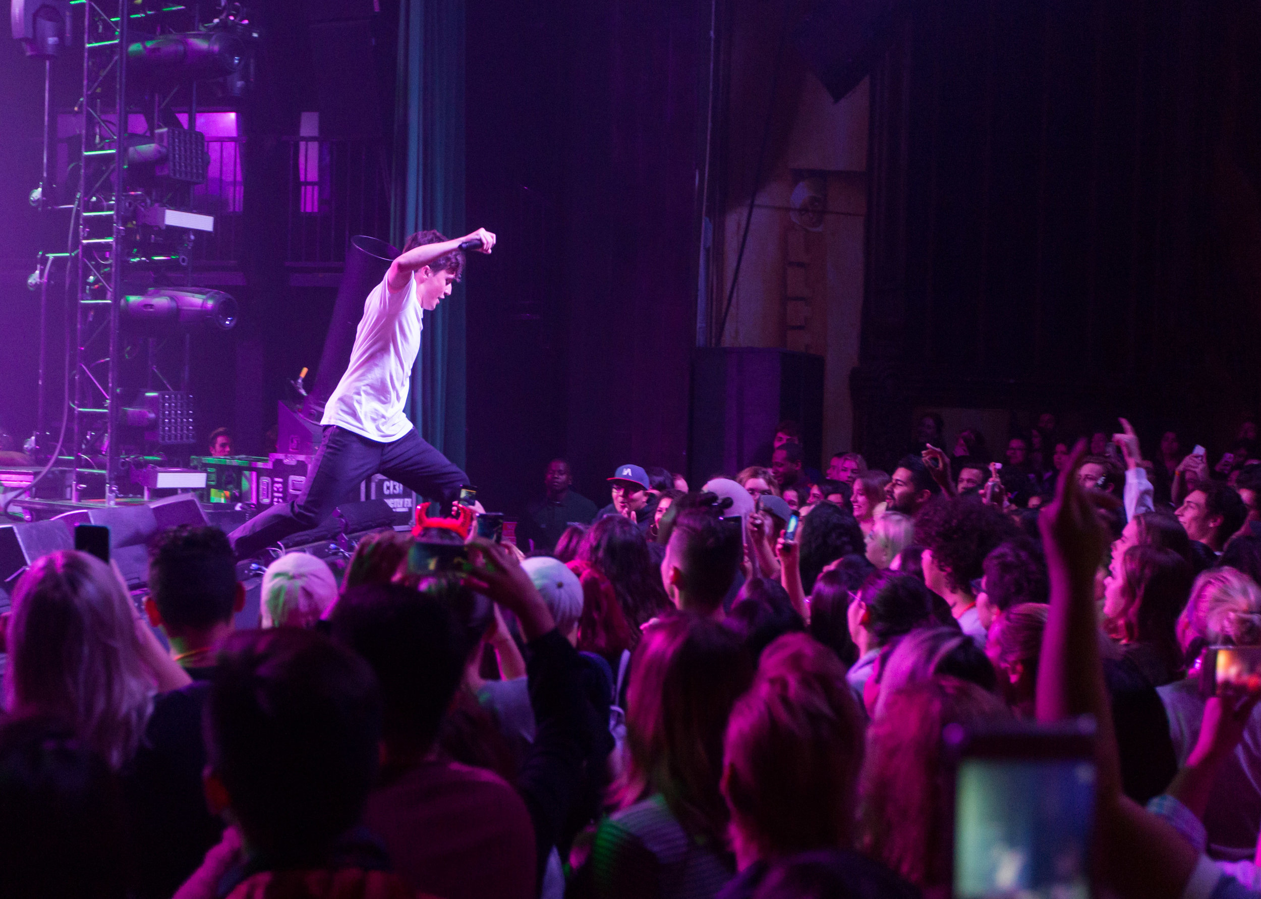  Rapper and singer Myles Parrish leaps into the crowd and had previously instructed the crowd to make a mosh pit in order for there to be room. Myles opened for Luke Christopher and Hoodie Allen during Hoodie Allen's "The Hype" tour named after his n