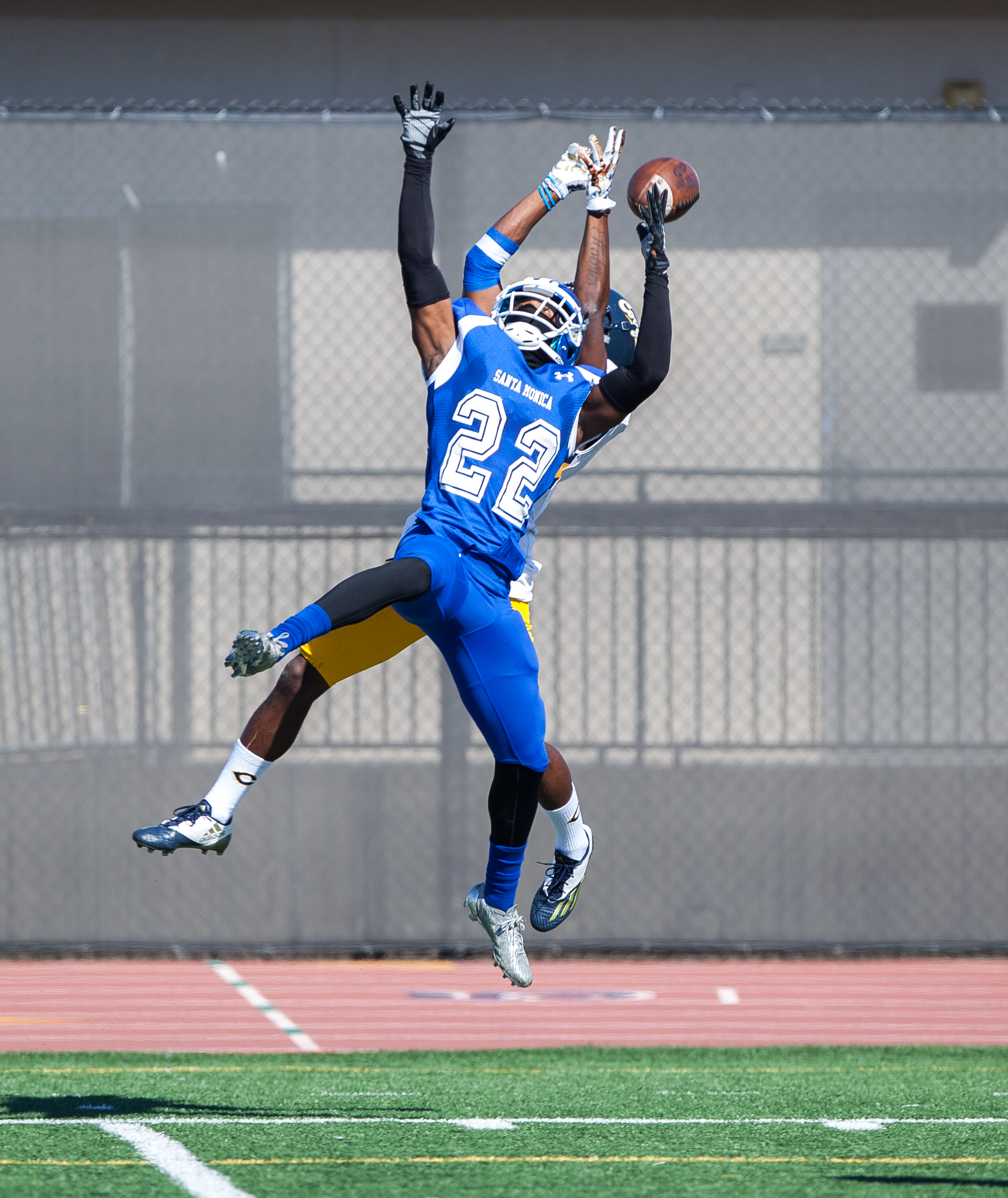  Richard Harbor III (22) of the Santa Monica College jumps up to perform the ball. College of the Canyons beat the Corsairs 48-7. The game was held at the Corsair Stadium at the Santa Monica College Main Campus in Santa Monica, California, on 4th of 