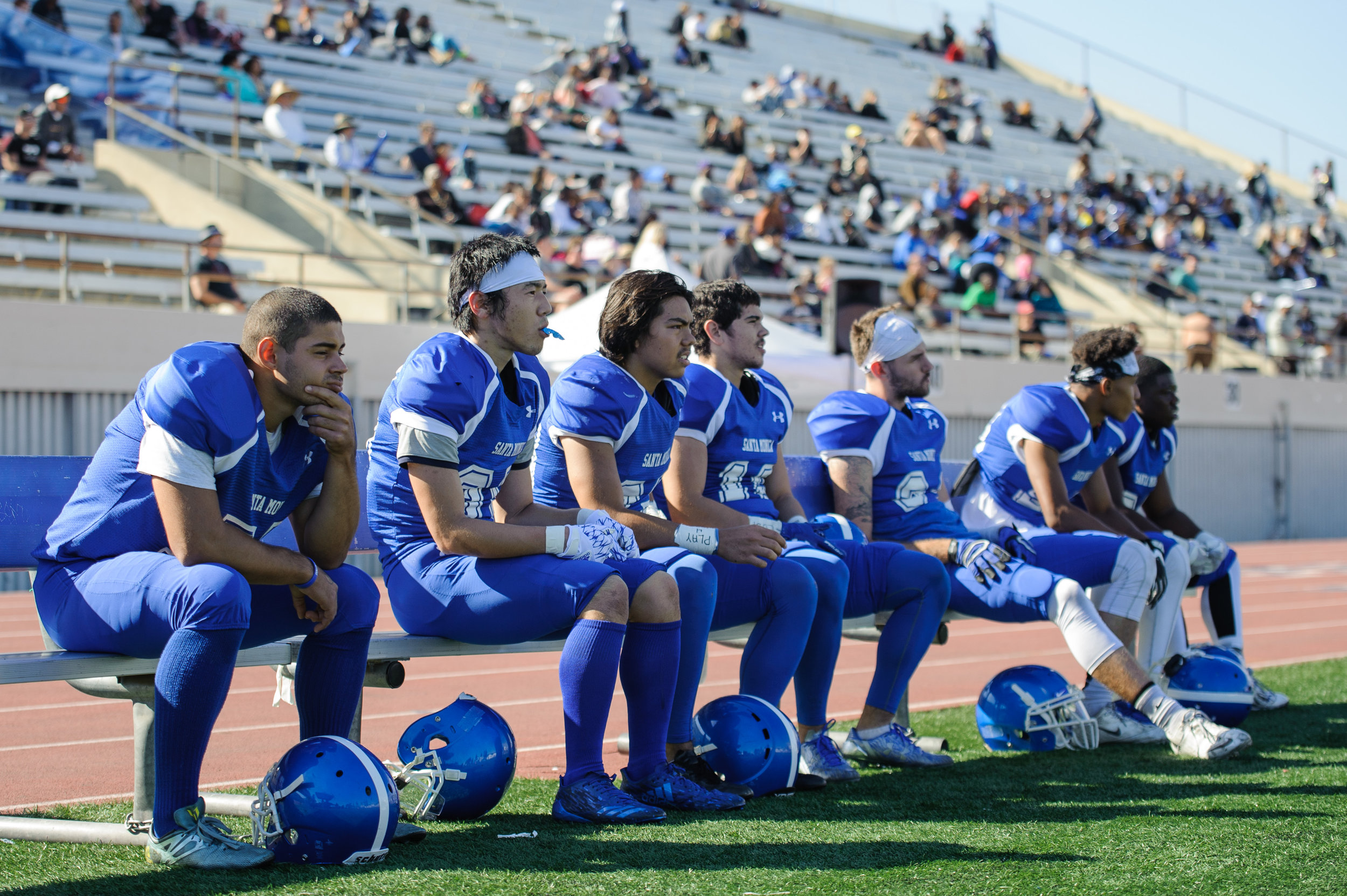  Several Corsairs watch from the sidelines as their teammates attempt to start a rally to recover from the large deficit. The Santa Monica College Corsairs lose their final home game 7-48 to the College of the Canyons Cougars and will play their fina