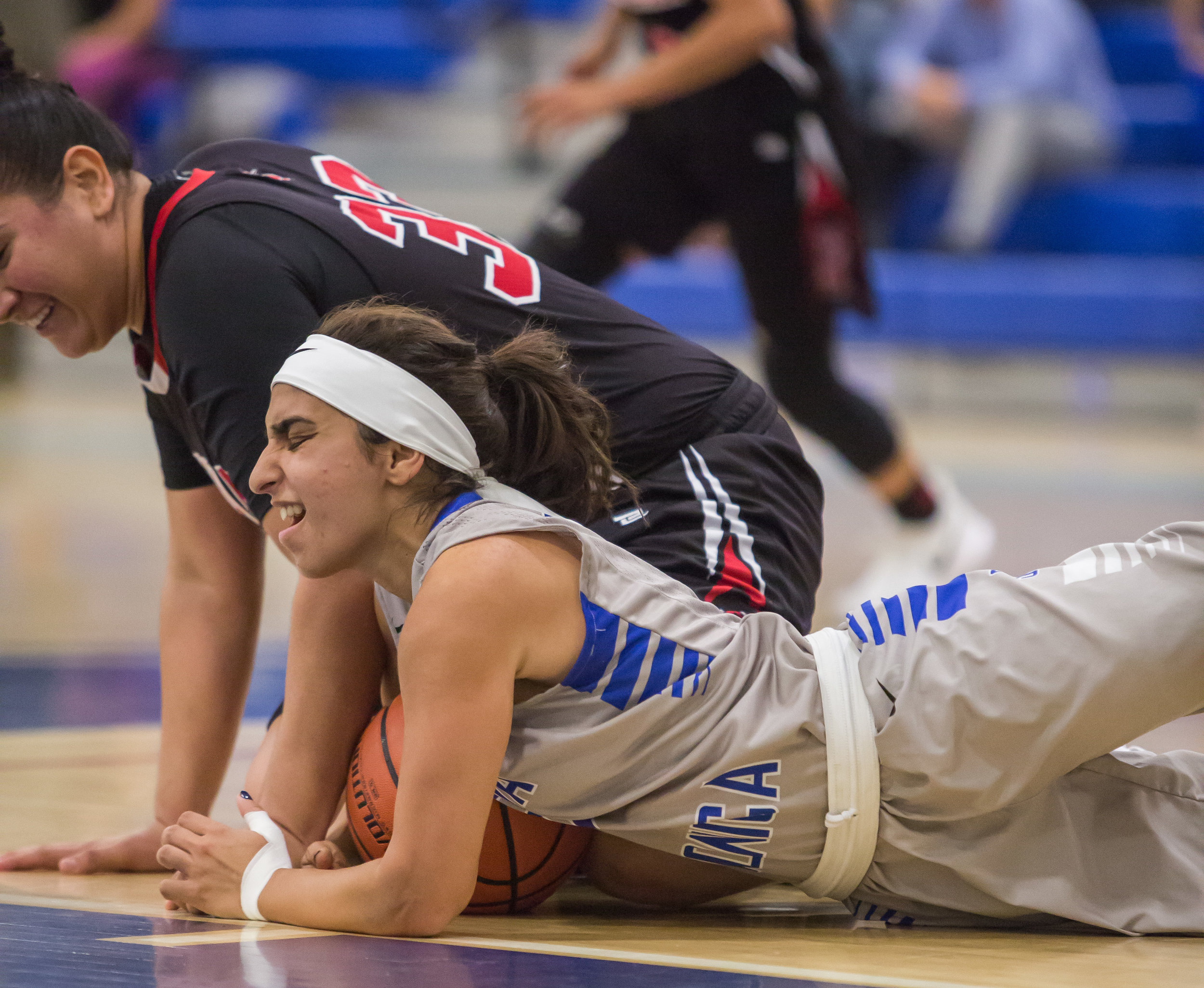  Guard Jessica Melamad (2) of Santa Monica College Corsairs fights for possession of a loose ball against Forward Alexis Casillas (33) of Santa Ana College. Santa Monica College Corsairs win the game 63-54 against Santa Ana College. On Saturday, Nove