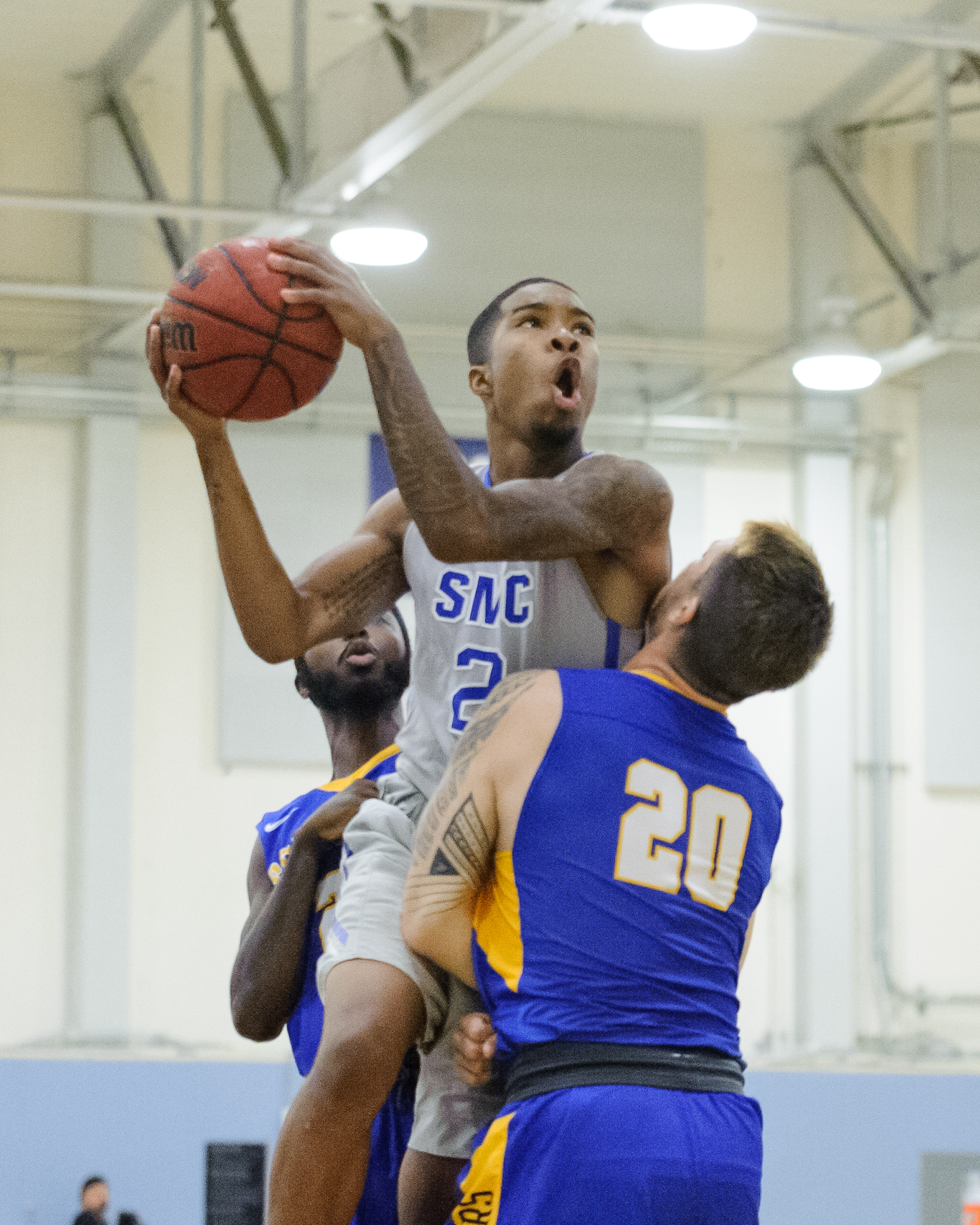  Guard Joe Robinson (2) of the Santa Monica College soars over the Southwest College defense for a shot attempt. The Santa Monica College Corsairs win their first home game of the season 84-53 against the Southwest College Cougars. The game was held 