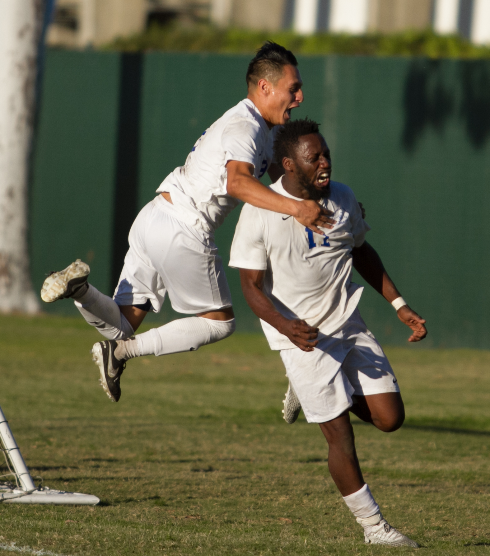  Santa Monica College Corsair Cyrille Njomo (17)(R) celebrates after scoring a goal with his teammate Chris Negrete (9)(L) during the match against Cerritos College on Wednesday, November 22, 2017, at Cerritos College in Norwalk, California. The Cors