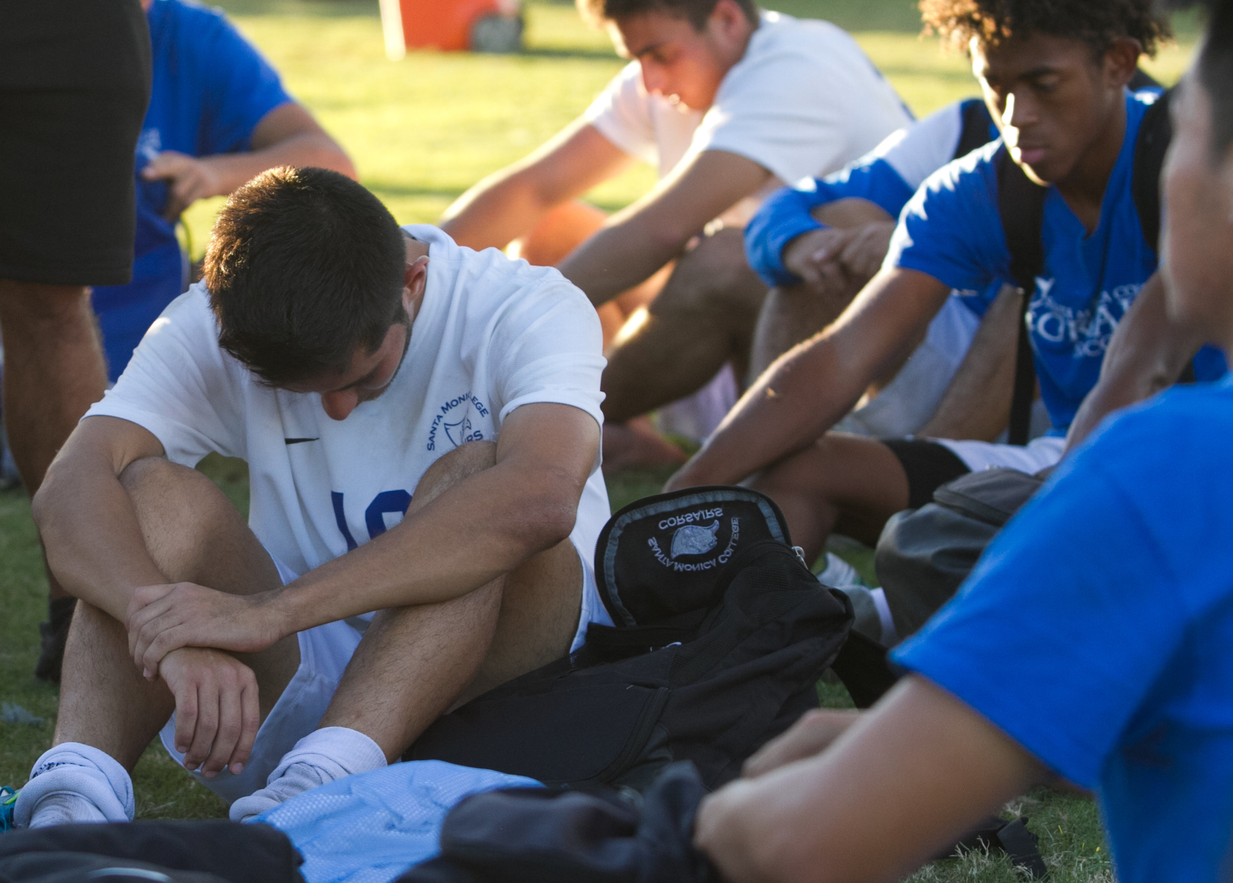  Santa Monica College Corsair Carlos Rincon (16)(CTR) has his head down as their coach addresses the team after losing to Cerritos College on Wednesday, November 22, 2017, at Cerritos College in Norwalk, California. The Corsairs lose 2-1 and are elim