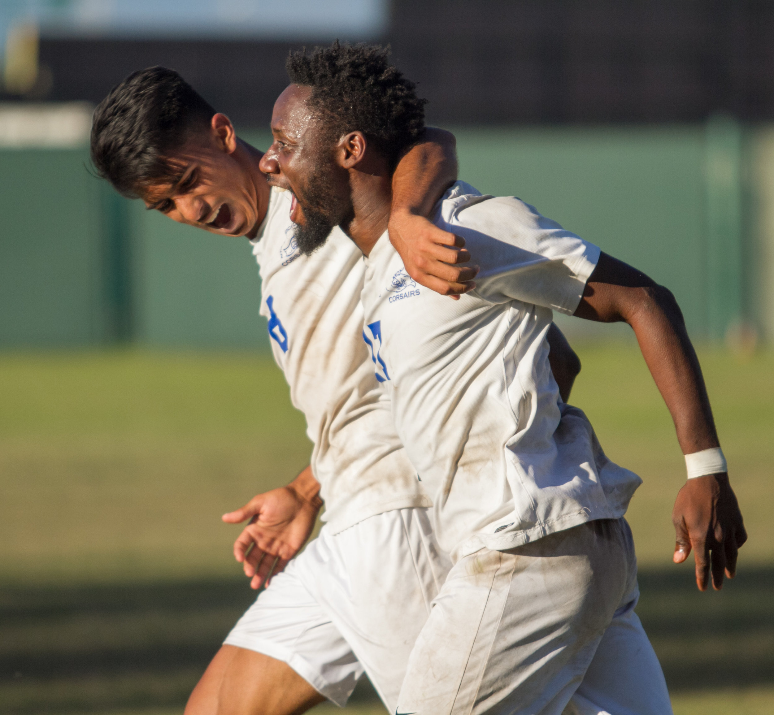  Santa Monica College Corsair Cyrille Njomo (17)(R) celebrates after scoring a goal with his teammate Chris Andy Naidu (8)(L) during the match against Cerritos College on Wednesday, November 22, 2017, at Cerritos College in Norwalk, California. The C