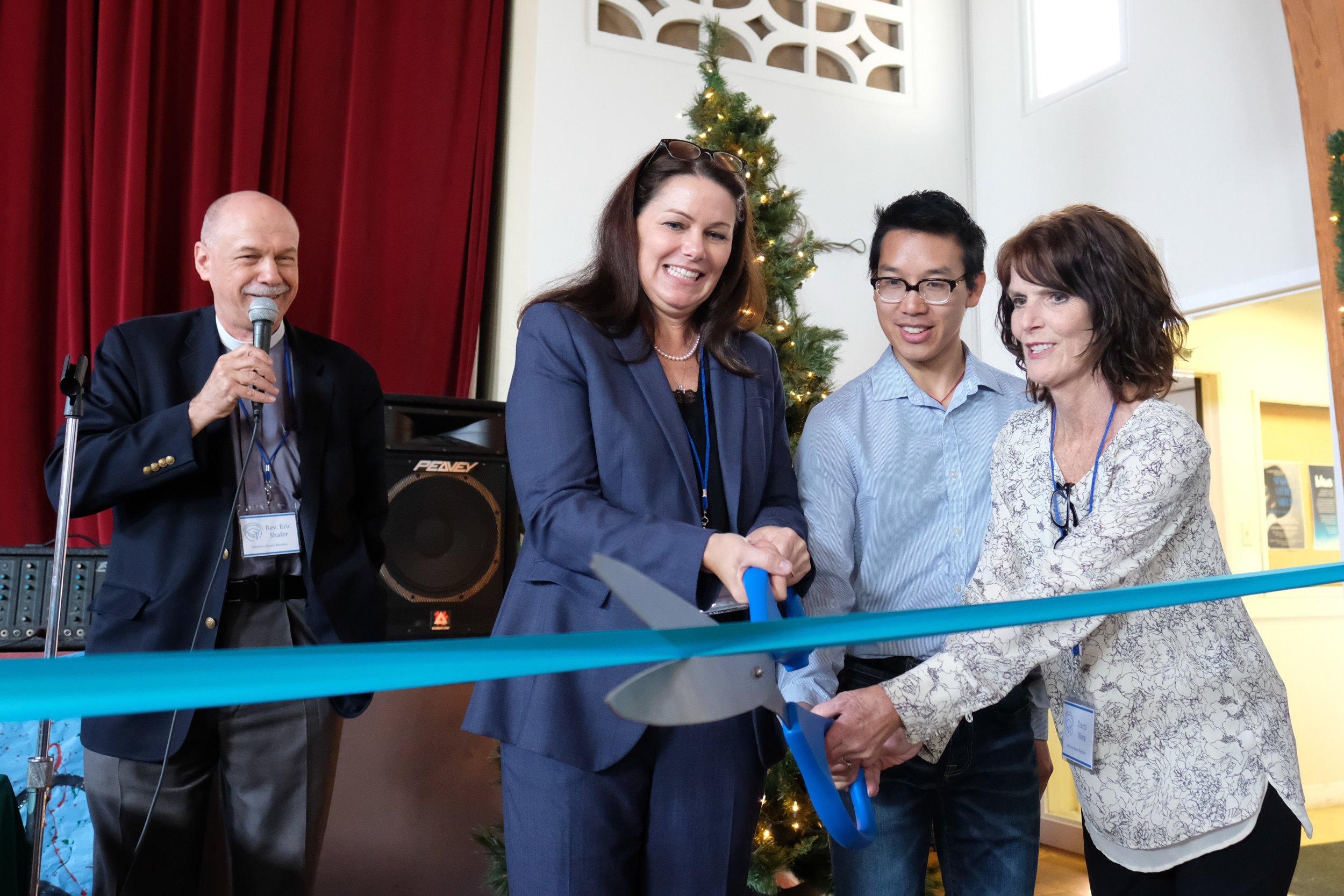  Rev. Eric Shafer (Left) Angela Millstein (Middle Left) Lewis Tse (Middle Right) Darci Niva (Right) cut the ribbon for the grand opening of the Student 4 Student Homeless Shelter at  Mt. Saint Olive in Santa Monica,CALIF on December 3, 2017. (Photo b