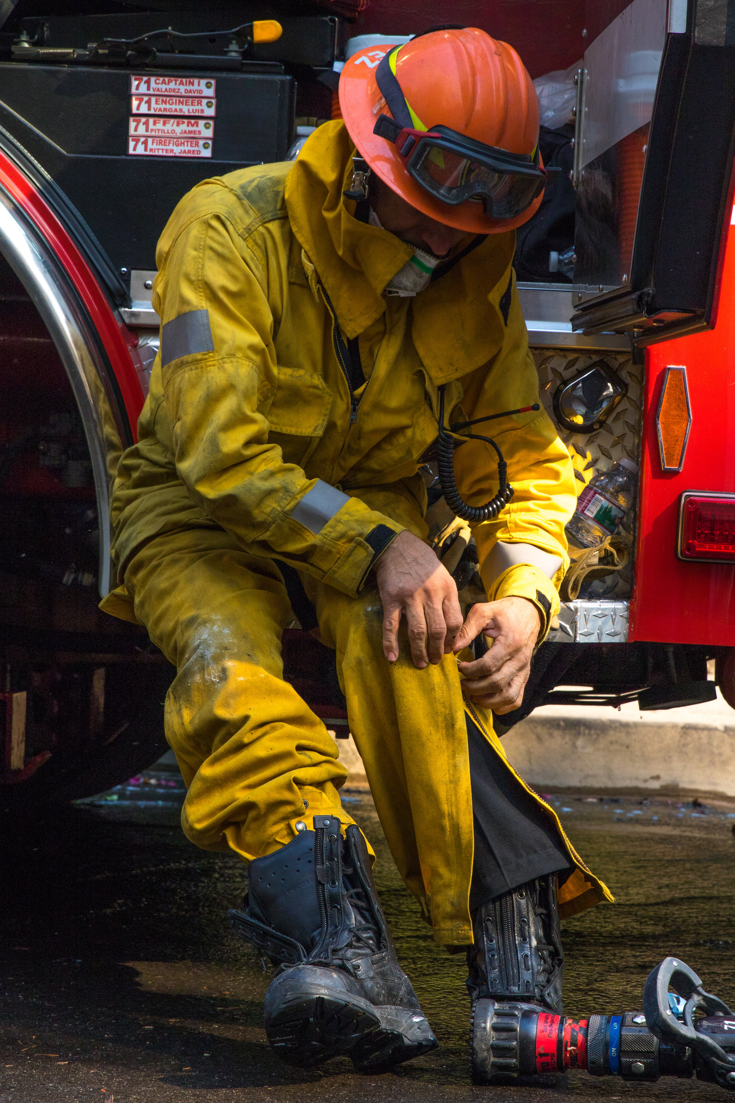  David Valdez puts on his fire suit before battling the Skirball fire. The Skirball Fire shut down the 405 and burned 450 acres of land on Dec. 6, 2017 in West Los Angeles, Calif. (Photo by Zane Meyer-Thornton)       