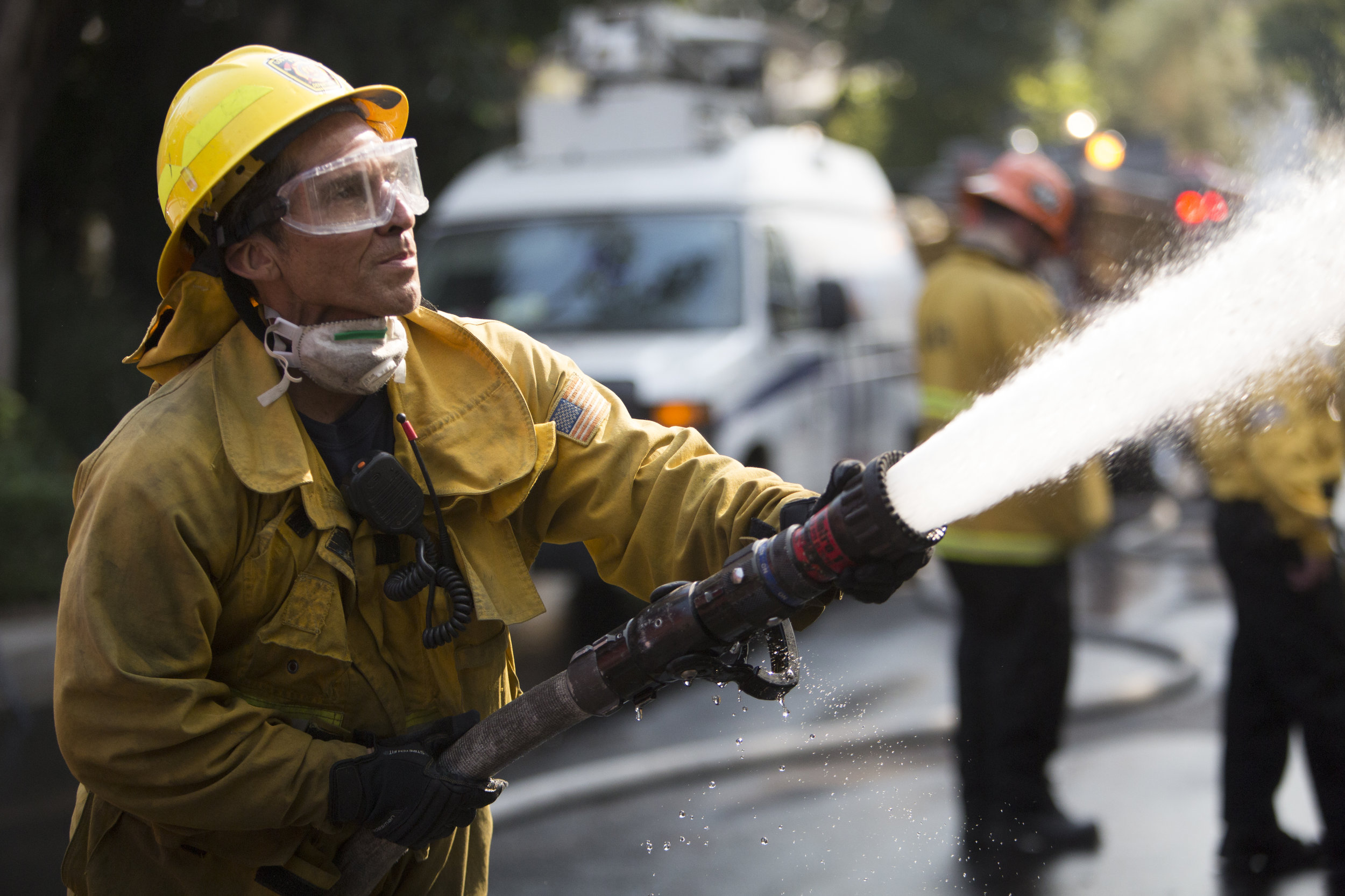  Los Angeles Fire Department engine company 71, firefighter Luis Vargas, works to put out the flames of a burning house at The Skirball Fire, which shut down the 405 north and burned 450 acres of land. On Dec.&nbsp;6, 2017 in West Los Angeles, Calif.