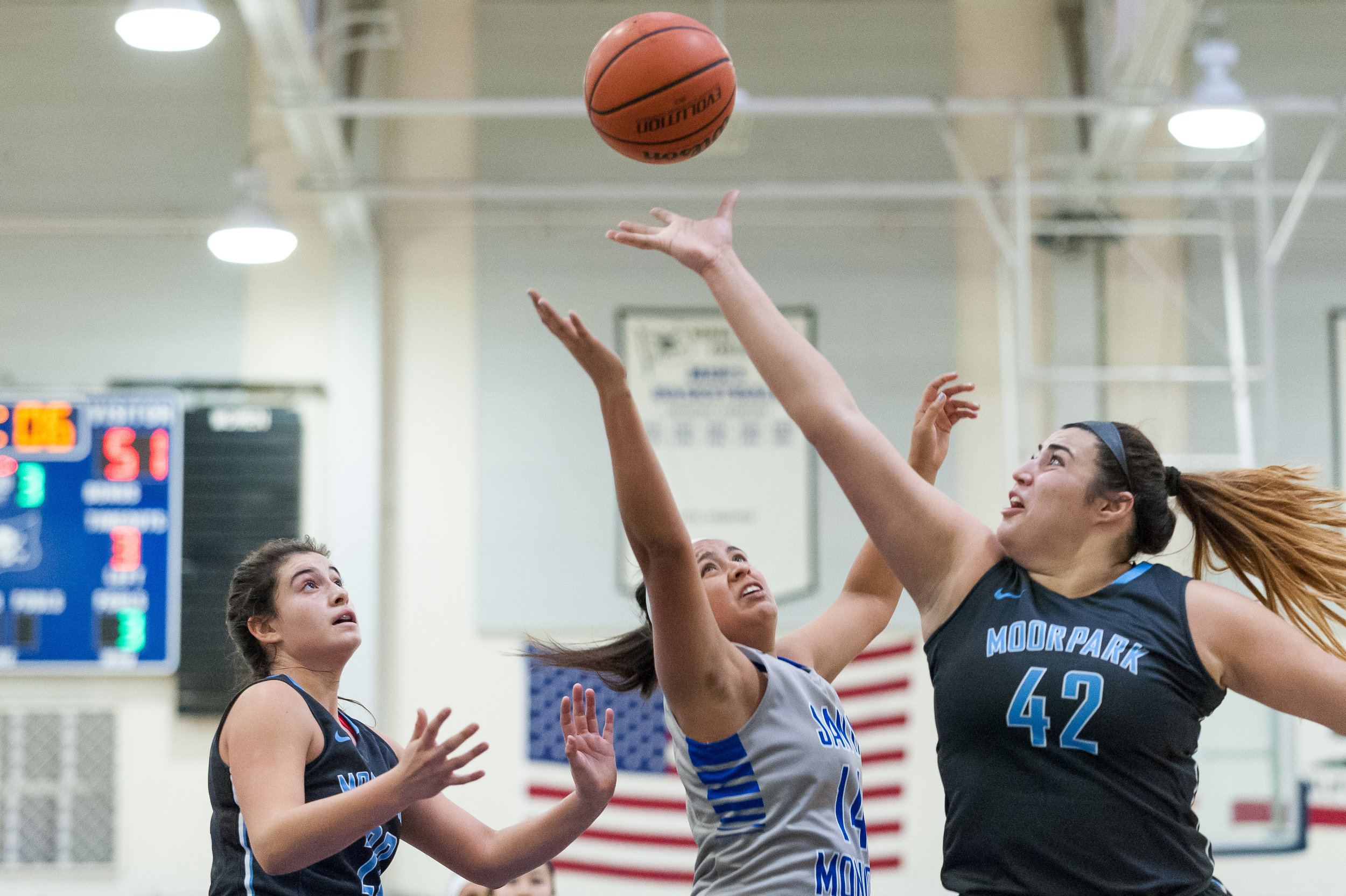  Forward Angelina Moreno (14,Center) of Santa Monica College makes a shot attempt but is blocked by center Barbara Rangel (42,Right) of Moorpark College. The Santa Monica College Corsairs lose the game 52-69 to the Moorpark College Raiders. The game 