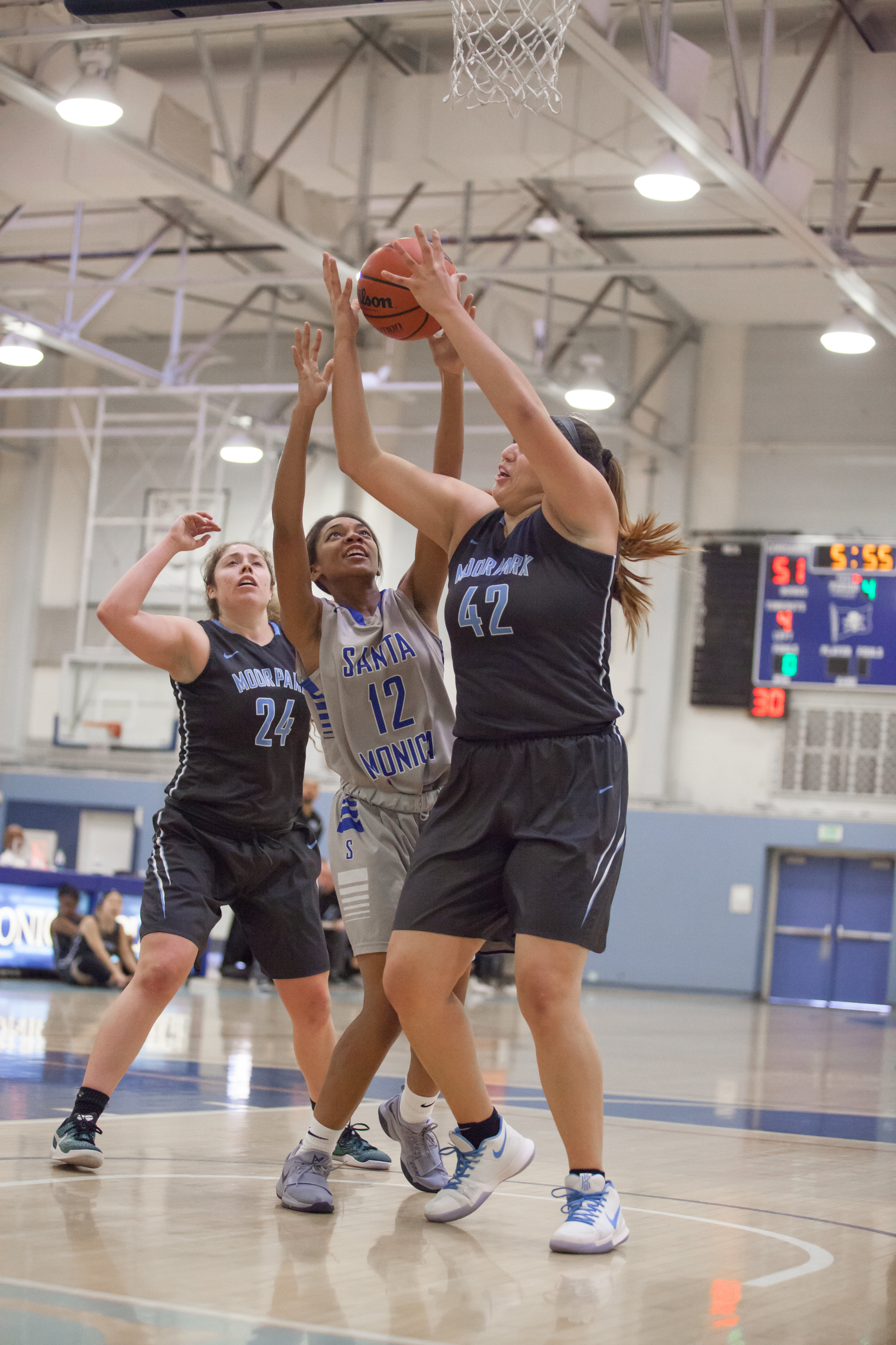  Jazzmina Oddie (12) of the Santa Monica College blocked by guard Barbara Rangel (42) of the Moonpark College. The Santa Monica College Corsairs loss the home game 52-69 against the Moonpark College. The game held on Saturday, December 9th, 2017 at S