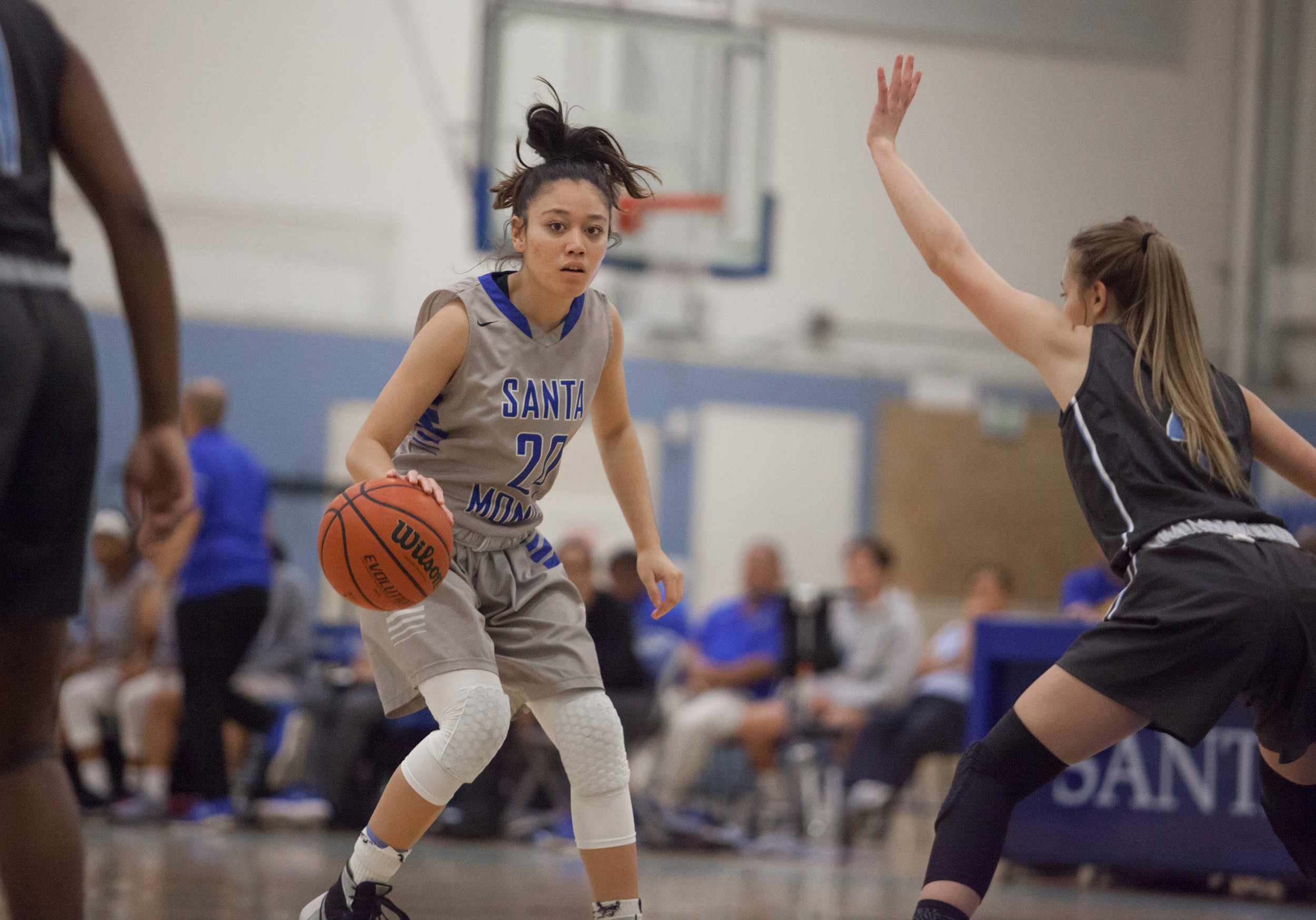  Maylene Cabral (20) of the Santa Monica College looks for an opening to create a shot while being defended by guard Kasey Nilsen (4) of the Moonpark College. The Santa Monica College Corsairs loss the home game 52-69 against the Moonpark College. Th