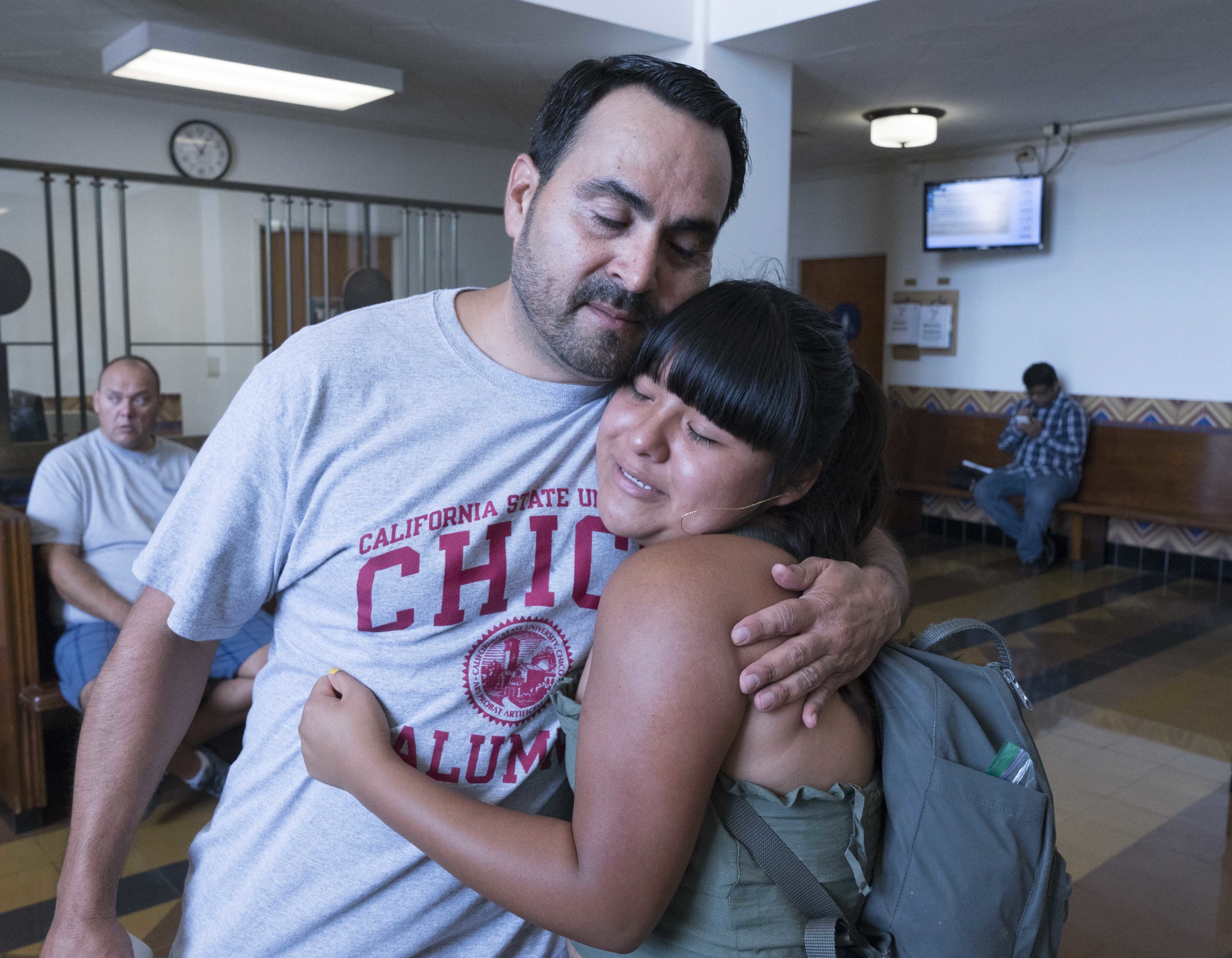  Santa Monica College student and activist, Salma Aguilar Morales, 19, receives a hug from Oscar de la Torre, Executive Director of the Pico Youth & Family Center and member of the Santa Monica Malibu Unified School District, after speaking at a rall