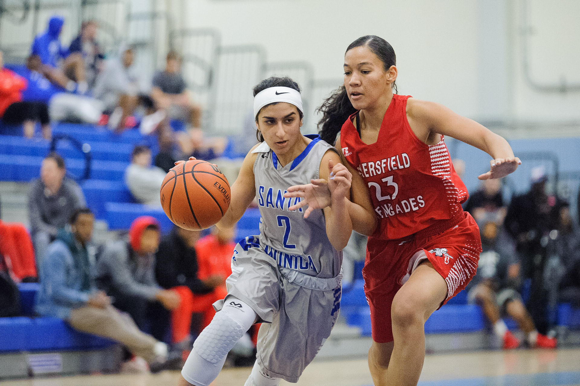  Guard Jessica Melamed (2,Left) of Santa Monica College dribbles past Octavia Croney (23,Right) of Bakersfield College. The Santa Monica College Corsairs lose the game 62-72 to the Bakersfield College Renegades. The game was held at the SMC Pavilion 