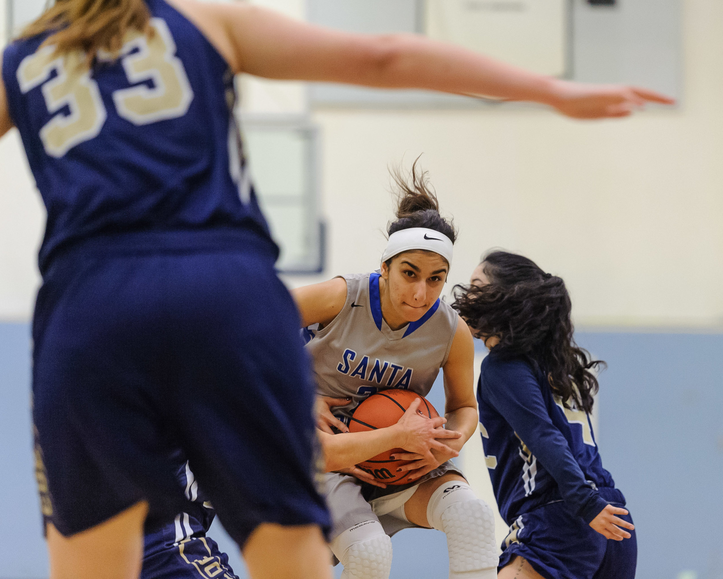  Guard Jessica Melamed (2,Middle) of Santa Monica College attempts to split a double team to get into the lane. The Santa Monica College Corsairs lose the game 108-70 to the College of the Canyons Cougars. The game was held at the SMC Pavilion at the