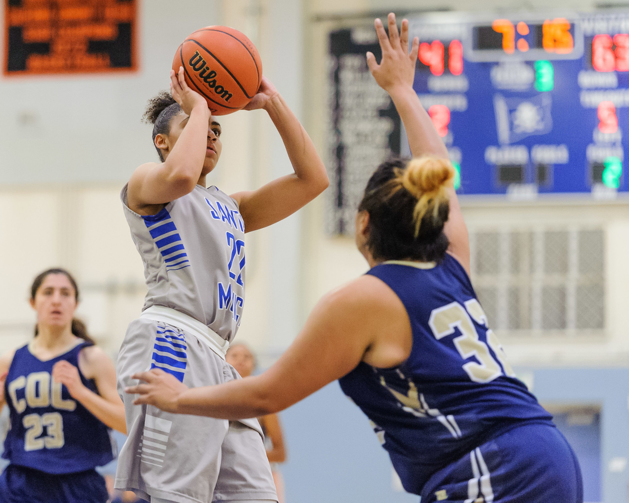  Jinea Cole (22,Left) of Santa Monica College goes up for a shot attempt as Janeth Cruz (32,Right) of the College of the Canyons closes in to contest Cole. The Santa Monica College Corsairs lose the game 108-70 to the College of the Canyons Cougars. 