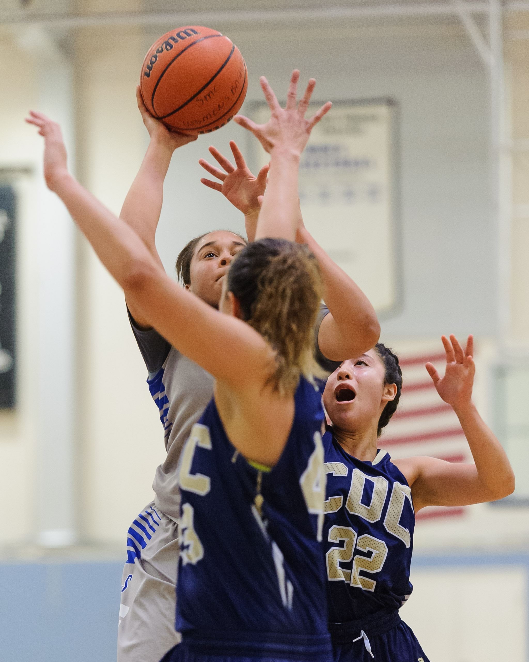  Rejinae Crandell (0,Left) of Santa Monica College shoots a shot in the lane while contested by the College of the Canyons defense. The Santa Monica College Corsairs lose the game 108-70 to the College of the Canyons Cougars. The game was held at the