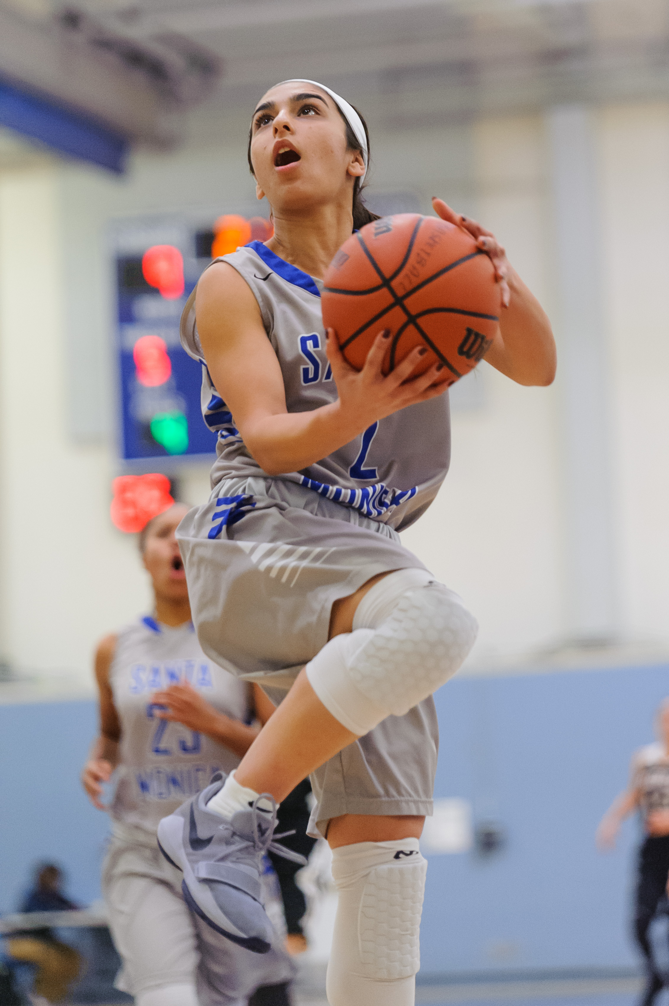  Guard Jessica Melamed (2) of Santa Monica College goes up for a reverse layup attempt. The Santa Monica College Corsairs win their final game of the season 76-53 against the Pierce College Brahmas. The game was held at the SMC Pavilion at the Santa 
