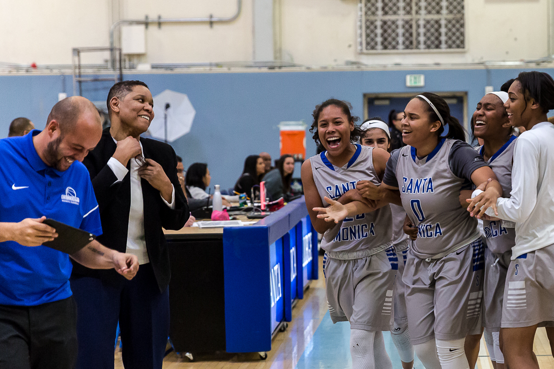  The Santa Monica College Corsair women’s basketball team go to celebrate with their lead coach Lydia Strong after their 76-53 blowout victory win over the Pierce College Brahma Bulls at the Santa Monica College Corsair gymnasium in Santa Monica Cali