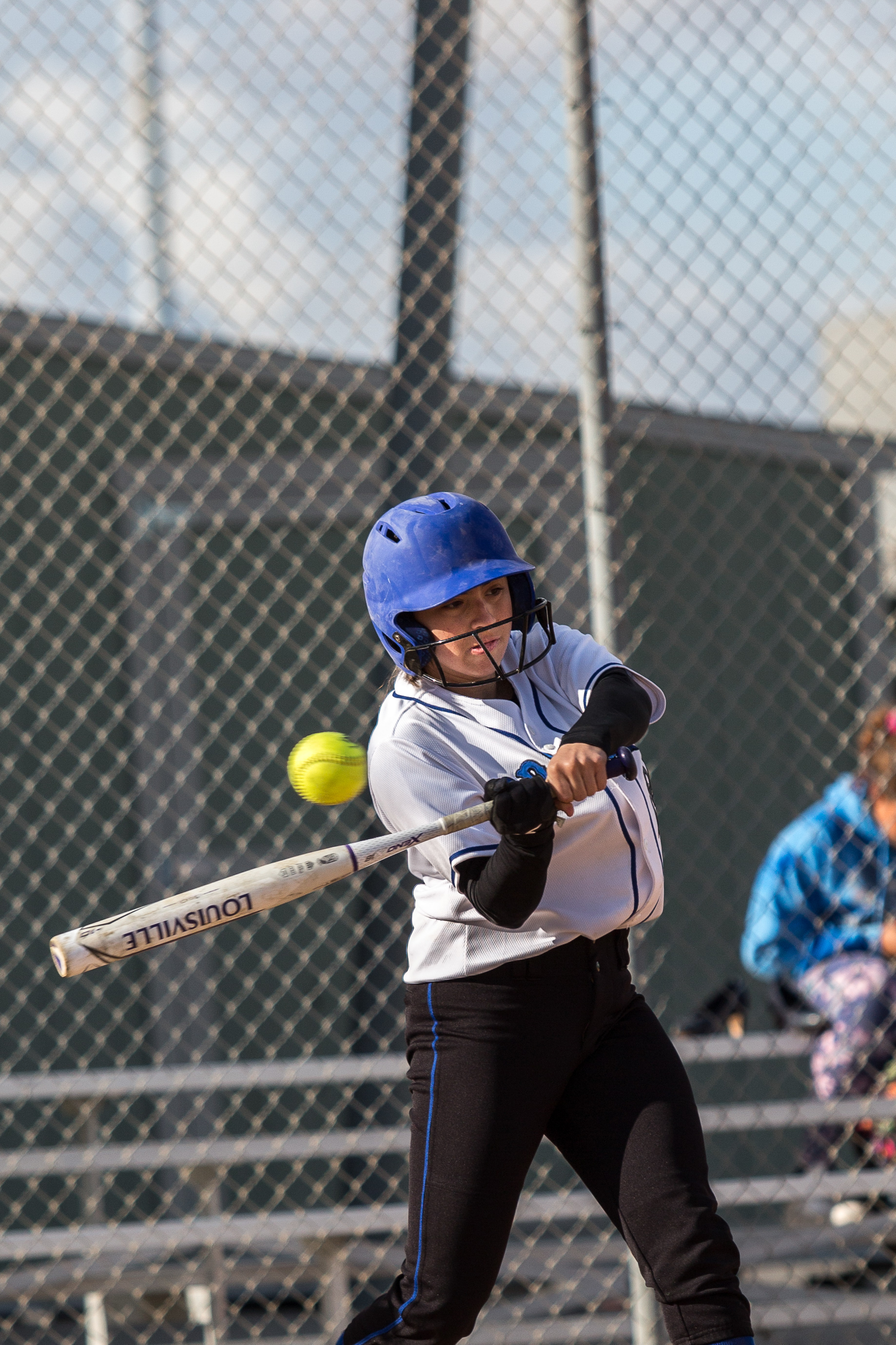  Santa Monica College Corsair freshman outfielder Aliza Chacon (#24, white) hits a single at the bottom of the 3rd at the Corsair Field in Santa Monica California, on Tuesday, February 27 2018. The Corsairs would go on to lose the game 0-14 against t