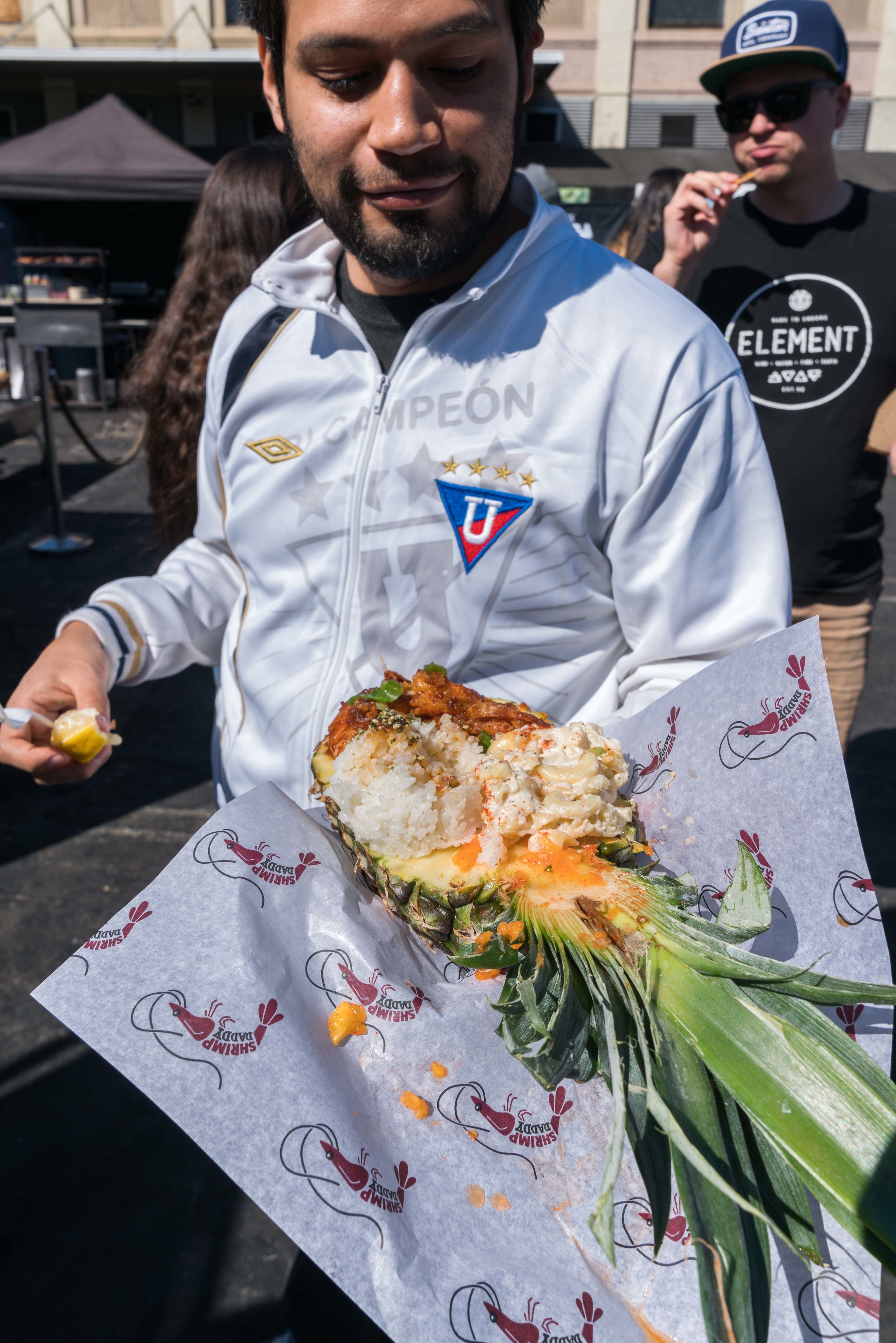  Gustavo Ordonaz eats Hawaiian-style garlic butter shrimp from Shrimp Daddy at Smorgasburg LA on Sunday, February 25, 2018 in the downtown section of Los Angeles, Calif. Smorgasburg LA is a collection of food and retail vendors that take place on Sun