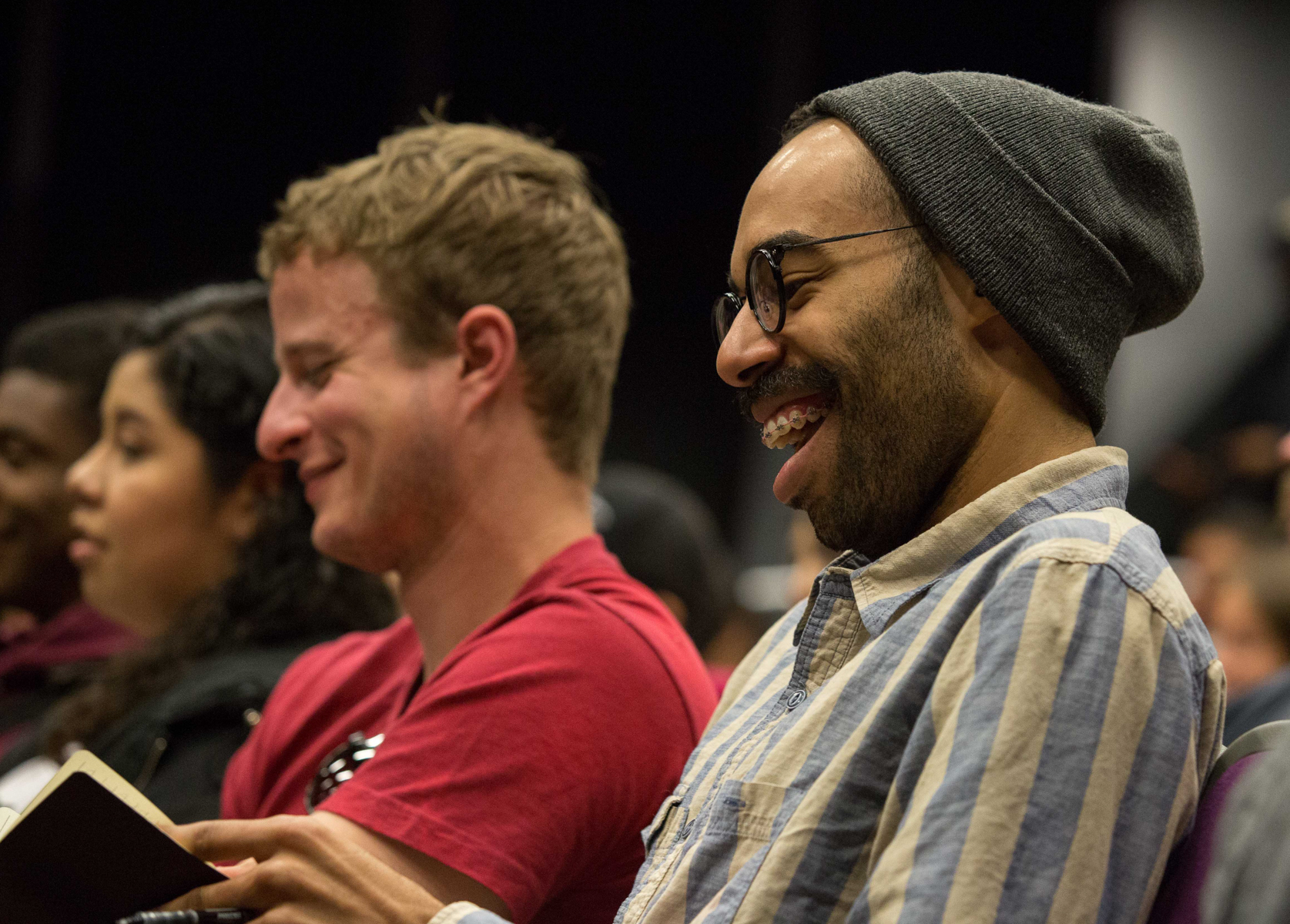 Santa Monica College student film major James Healey laughs while taking notes during the lecture Series “Inclusion in TV: Q&A with Marvel and DC Comics Television Writers” that is being presented by the Santa Monica Community College Media and Communication Studies departments in the Santa Monica College Center for Media Design campus lecture hall in Santa Monica Calif., on Wednesday, February 28, 2018. Writer Akela Cooper (Marvel's Luke Cage, American Horror Story: Cult, The 100), Jenny Lynn (DC Comics’ Arrow, Serenity, Daybreak), and Charles Murray (Marvel's The Inhumans, Marvel's Luke Cage, Sons of Anarchy, HBO's Oscar Micheaux biopic) discuss how their respective backgrounds enhance storytelling in the world of Marvel, DC Comics, and 21st-century Hollywood. (Corsair Photo: Matthew Martin)