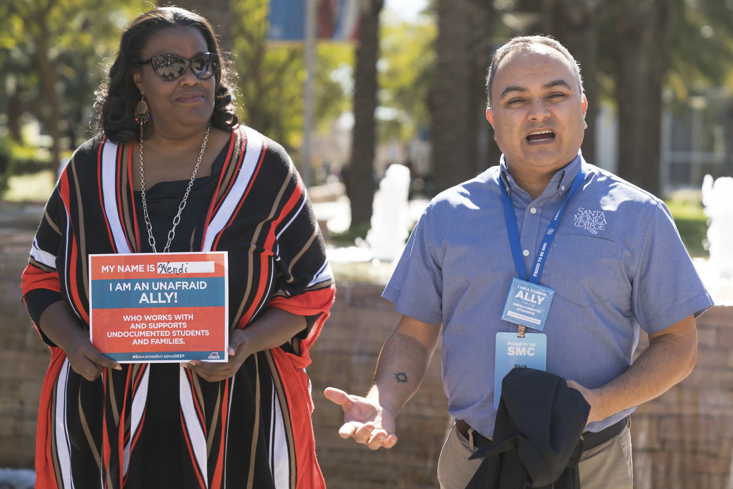 Nick Mata (right), Director of Programs at Santa Monica College, (SMC) gives a speech on Monday, March 5, 2018 on SMC's main campus in Santa Monica, Calif. at the start of the DACA Day of Action event. Wendi DeMorst (cq) (left), Director of Suppleme