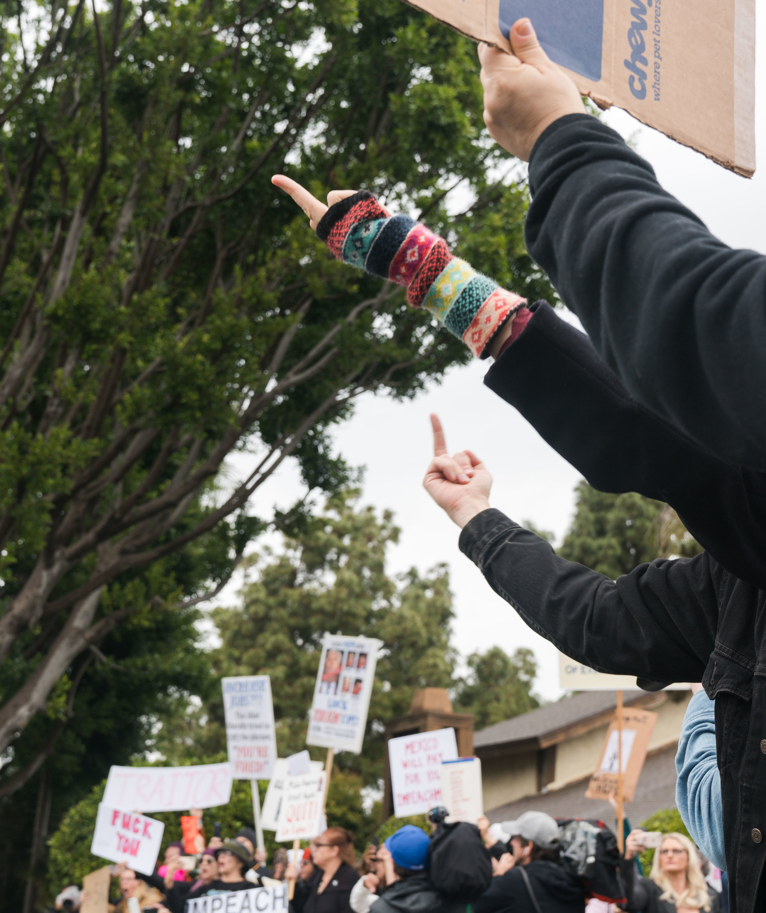 Protesters flip off President Donald Trump's passing motorcade in Santa Monica, California on Tuesday, March 13, 2018. This was Trump's first visit to California since taking office in January 2017. (Helena Sung / Corsair Photo)