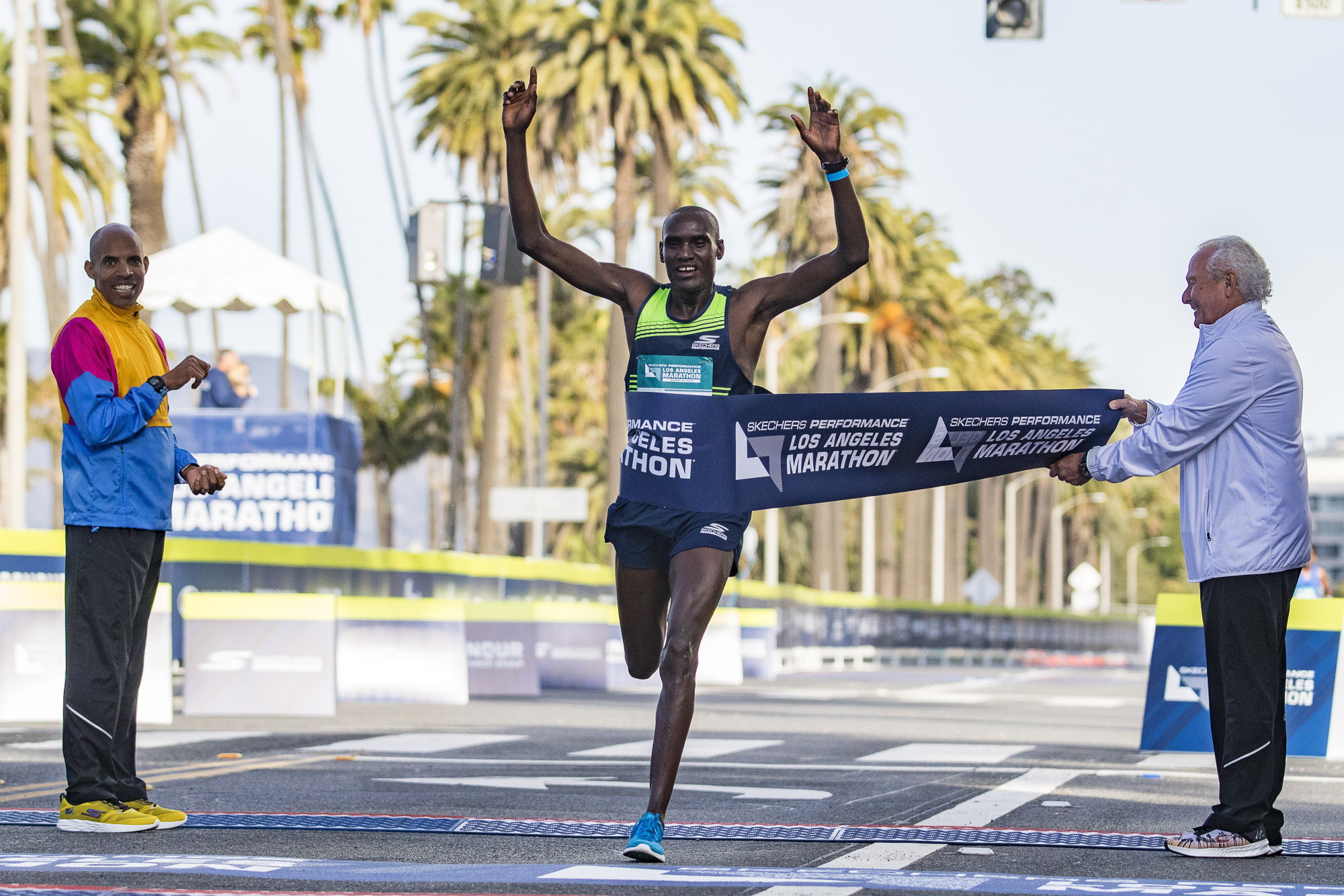  Weldon Kirui (middle) wins the Los Angeles Marathon on March 18, 2018 in Santa Monica, California with a time of 2:11:48. Kirui has won 2 out of the last 3 Los Angeles Marathons. (Zane Meyer-Thornton/Corsair Photo) 