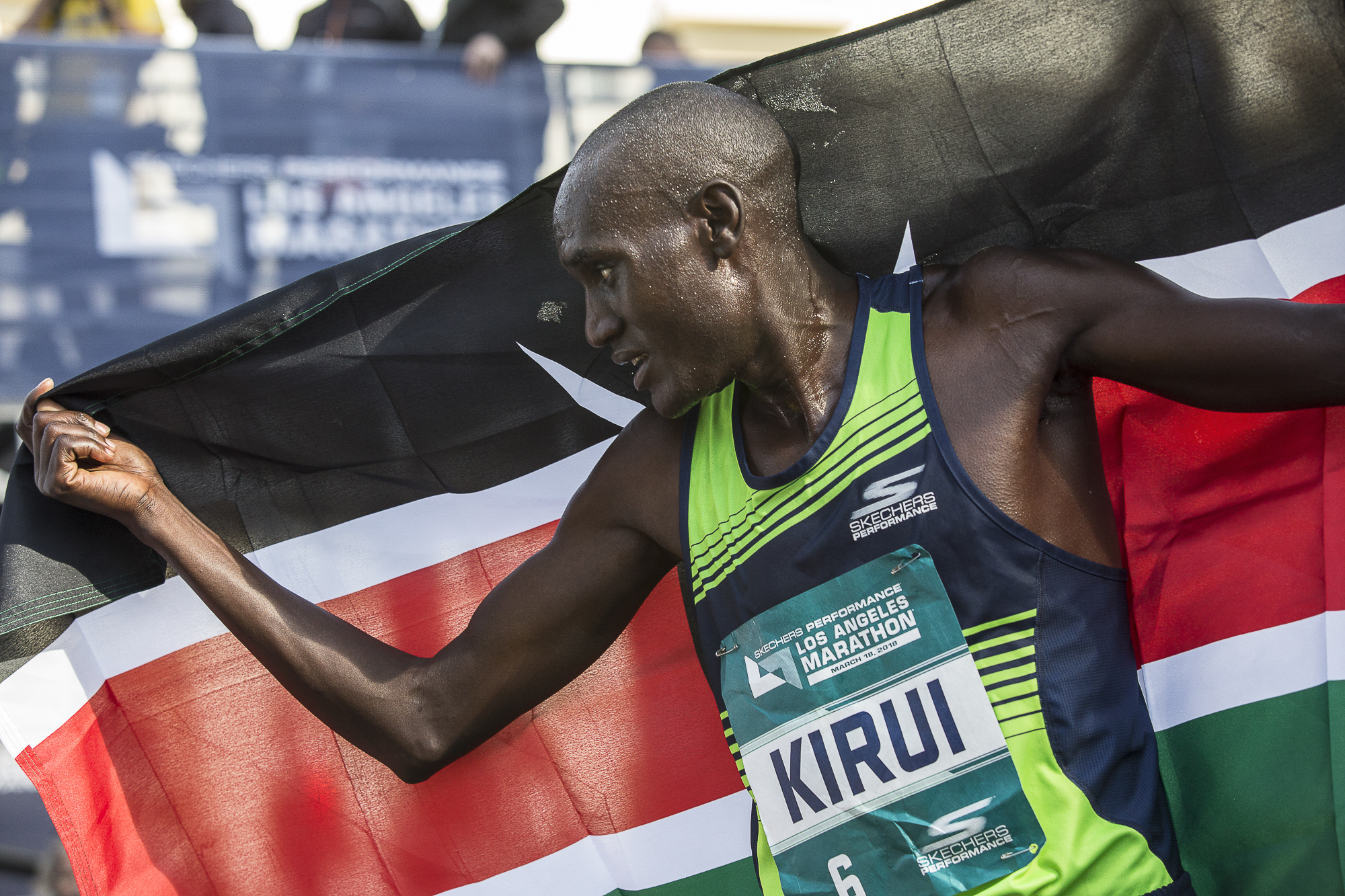  Weldon Kirui proudly holds the flag of his native country Kenya over himself after winning the 33rd annual Los Angeles Marathon on March 18, 2018 in Santa Monica, California with a time of 2:11:48. Kirui has won 2 out of the last 3 Los Angeles Marat