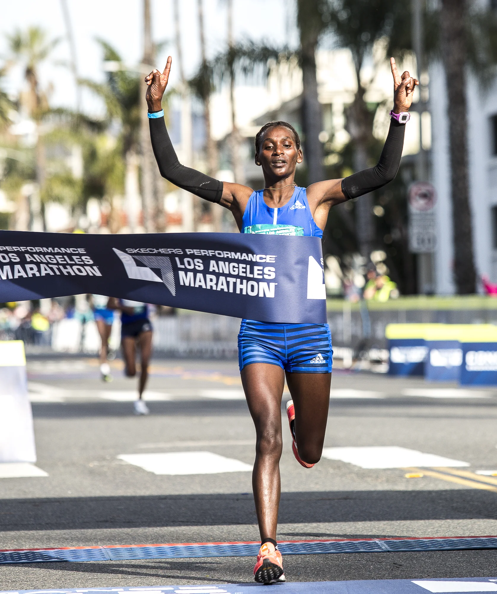 Sule Gedo crosses the finish line, wining the pro-women’s 33rd annual Los Angeles Marathon event with a time of 2:33:50 on March 18, 2018 in Santa Monica, California. (Matthew Martin/Corsair Photo)
