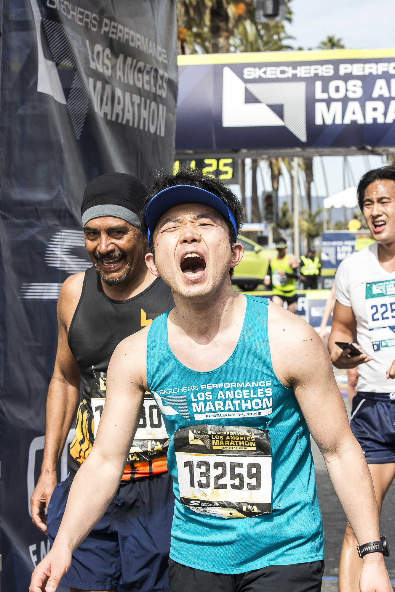 Toshihiko Tateshita (bib #13259) (center) screams with joy after completing the 33rd annual Los Angeles Marathon event with a final time of 3:52:36 in Santa Monica, California on Sunday March 18, 2018. “I did it…I finally did it! And no one can take