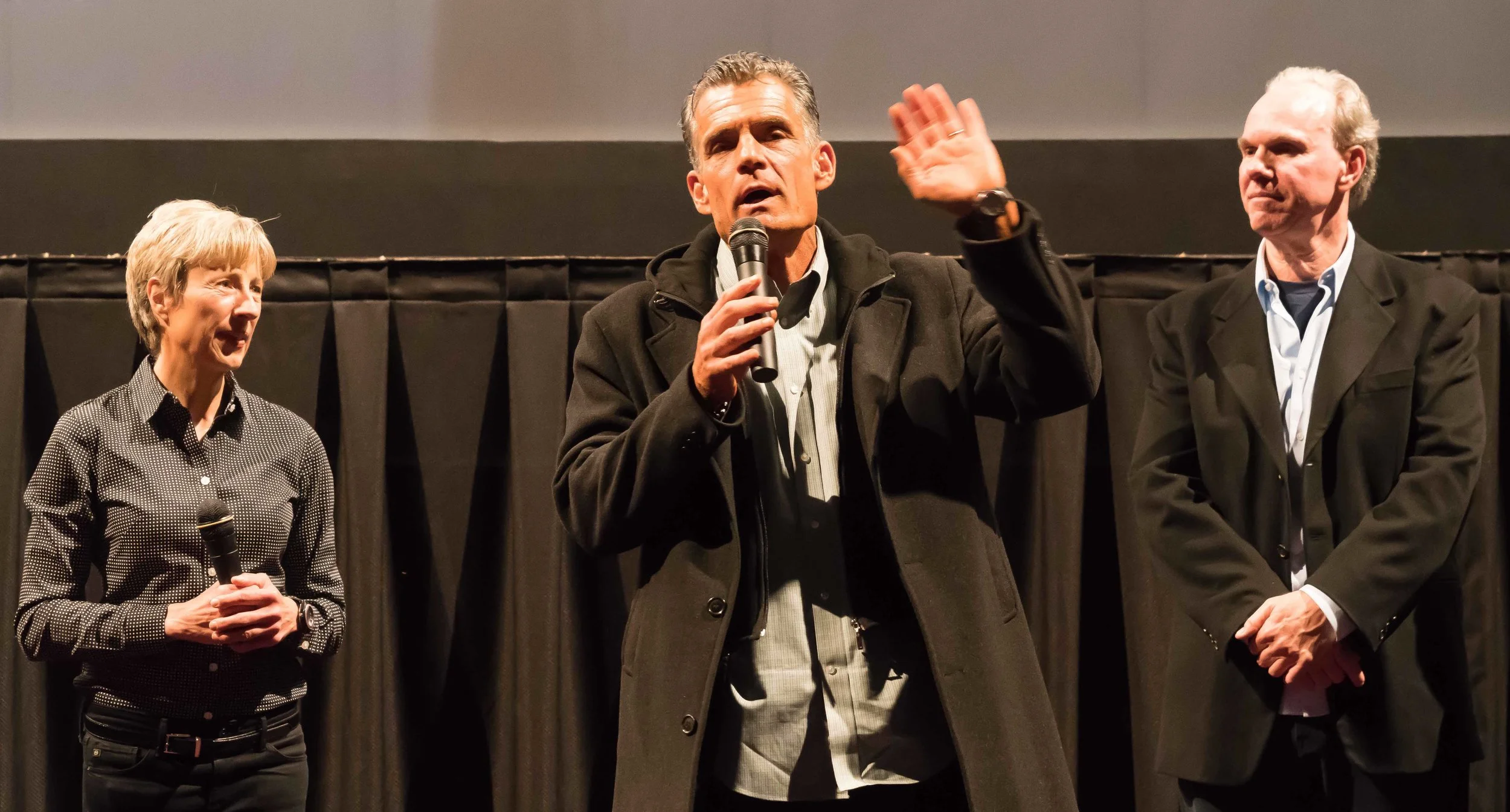 Judge Craig Mitchell (center) speaks at a screening of the documentary, Skid Row Marathon, in Los Angeles, California on March 16, 2018. Gabriele Hayes (left) produced the documentary with her husband, Mark Hayes (right), who directed it. (Helena Sung/Corsair Photo)