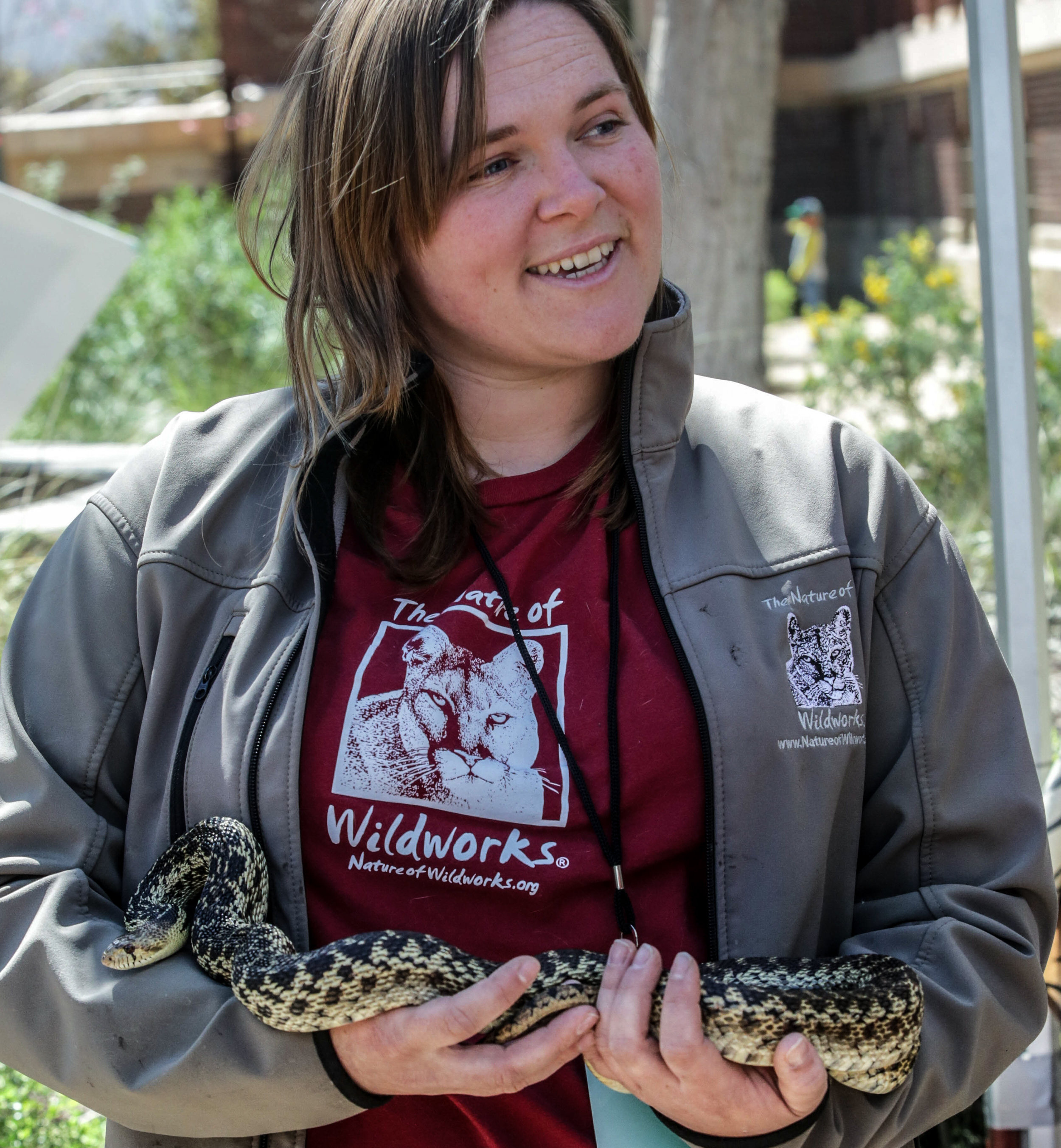  Nicole Wilson craddles a Gopher Snake (Jake), offering children and others guests at the Los Angeles Nature Fest on opportuinity to touch and learn about Jake up close. Wilson was at the Natural History Museum on the University of Southern Californi