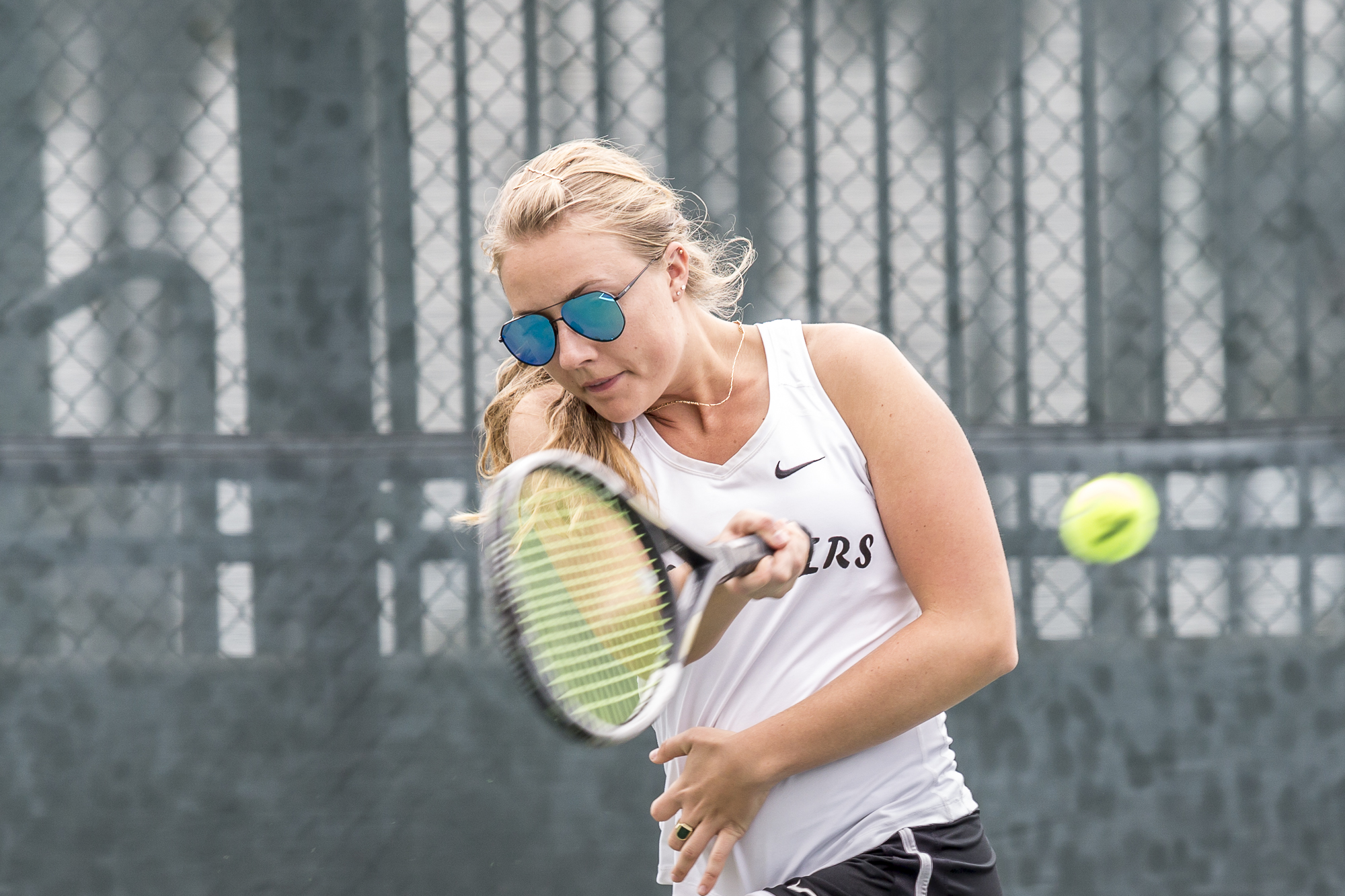 Santa Monica College Corsair Amanda Golling (#3, singles) powers through a forehand swing against her Glendale City College Vaquero opponent, in her singles match, at the Ocean View Park Tennis Courts in Santa Monica, California on Tuesday, March 20 2018. Golling would go on to lose both sets of her game, 0-2, adding to the Corsairs 0-7 loss against the Glendale College Vaqueros. (Matthew Martin/Corsair Photo)