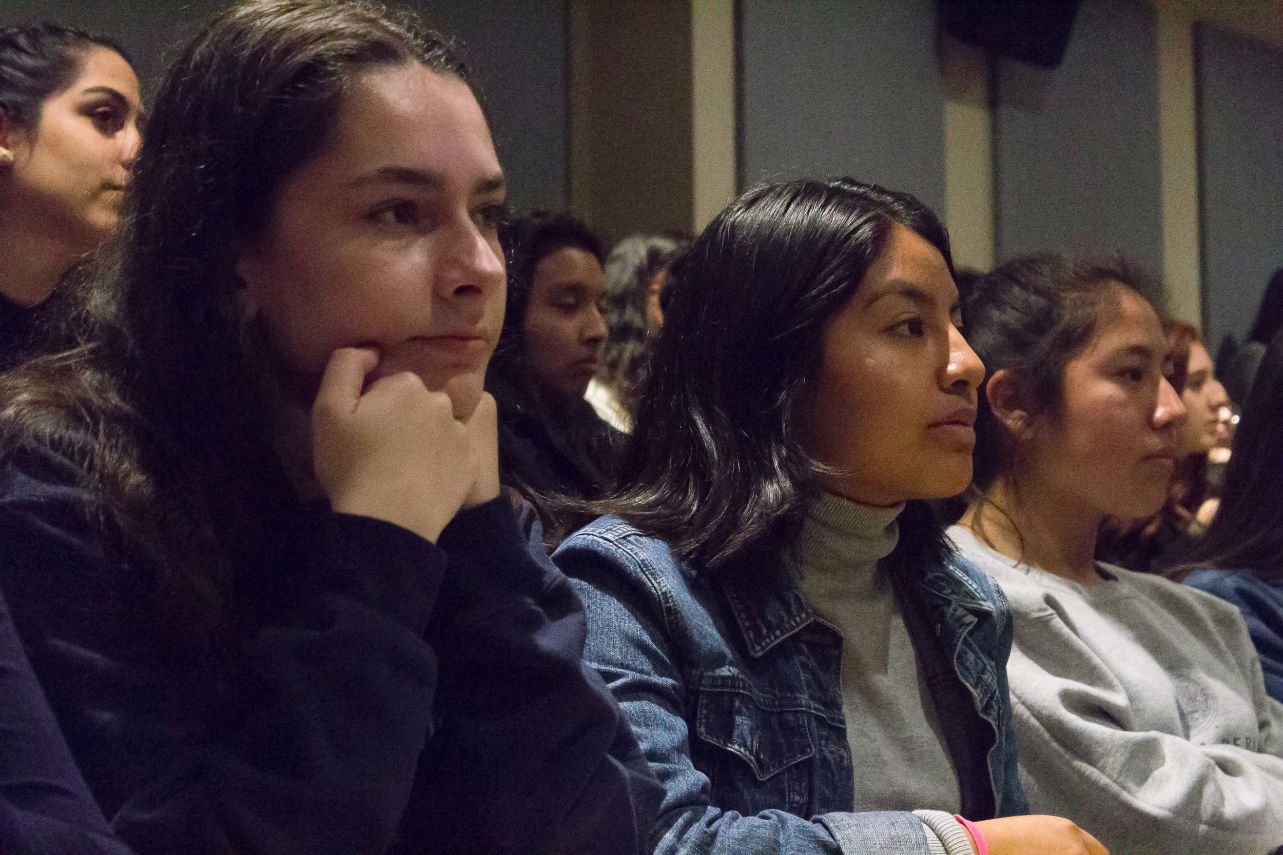 Chelsea Moran, 17 (left) and Melisa Ramirez Hernandez, 15 (middle), are students from Santa Monica High School. They came with 13 other students as a field trip through their Spanish program to see Jenny Lorenzo. The Award Winning YouTube star, talked to the students about promoting Latinx Voices in Social Media, at Santa Monica College, in Santa Monica, California, on Tuesday, March 20, 2018. The room HSS165 and its 120 seats were full, about 15 students had to wait in the hallway, by the door. (Emeline Moquillon/ Corsair Photo)