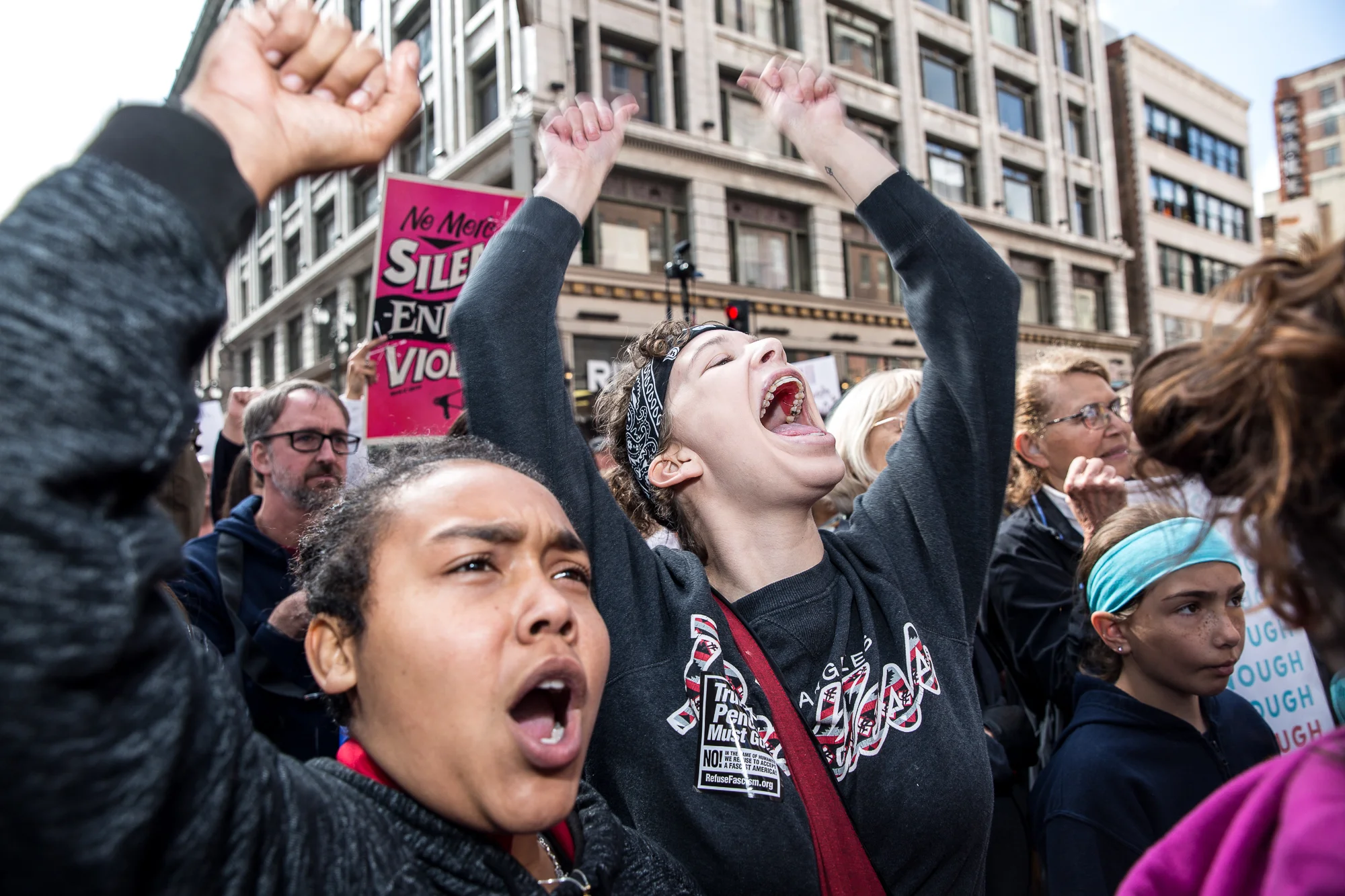 Alex Garcia (left) and Avery Dehart (right) cheer and shout with enthusiasm as they listen to guest speakers give their opinion on the lack of gun regulation in the U.S before protestors began their march toward city hall in downtown Los Angeles, California on Saturday, March 24 2018. The rally began near Pershing Square at 9 a.m. and the march moved to Grand Park, where there were speakers and performers. Speakers included students and survivors of previous mass shootings like Columbine, Las Vegas and the Seal Beach salon shooting.(Matthew Martin/Corsair Photo)