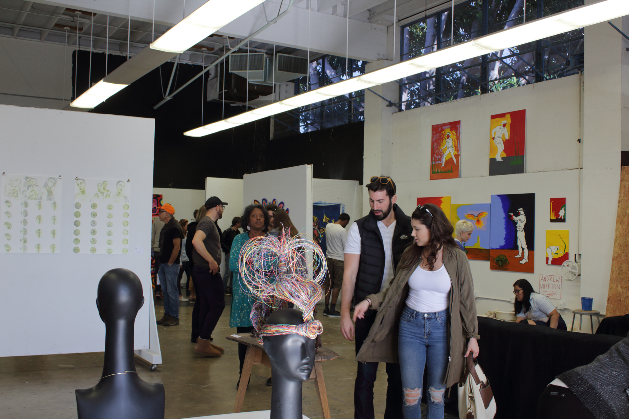  Spectators walk through the SMC Art Mentor Program gallery, mentored by Christopher Badger, at the 12 Annual Santa Monica ArtWalk on March 24th, 2018 in Santa Monica, California. (Heather Creamer/ Corsair Photo).. 