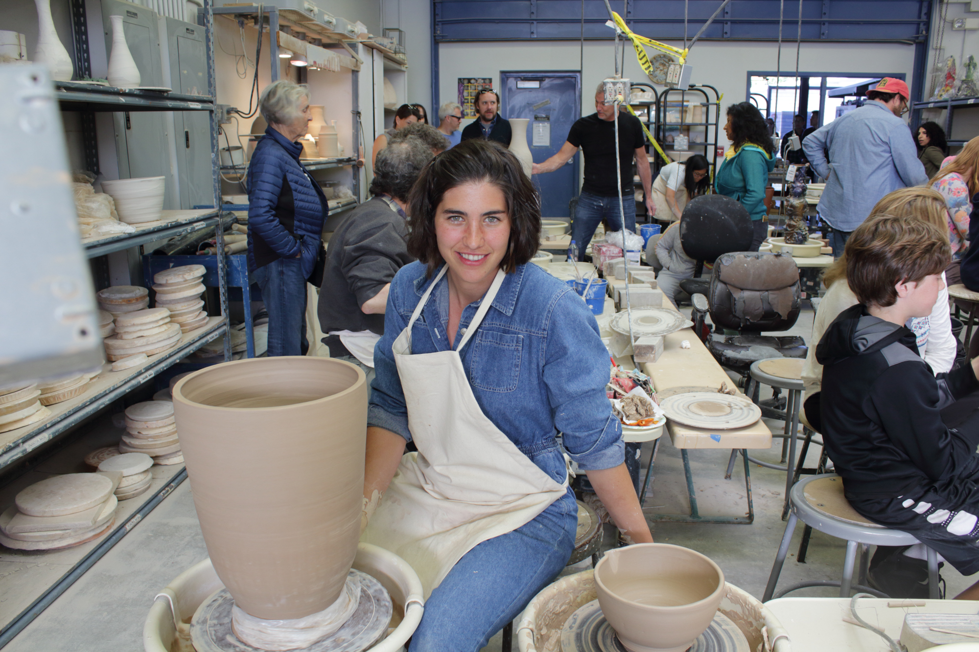 Nerea Nicholson, an Early Childhood Development major at SMC with a love for ceramics, poses while working on two pieces in the SMC Ceramic Arts Gallery at the 12 Annual Santa Monica ArtWalk on March 24th, 2018 in Santa Monica, California. (Heather Creamer/ Corsair Photo).