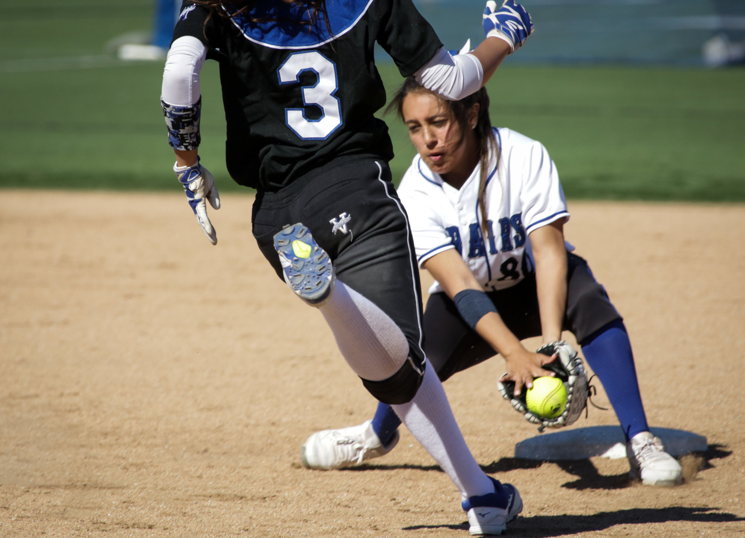  Santa Monica College Corsair softball team player Emma Soto (Right) in the process of successfully forcing out her opponent during their game against Allan Hancock College on Tuesday, March 27th, 2018. The game ended 8-1 in favor for Allan Hancock C