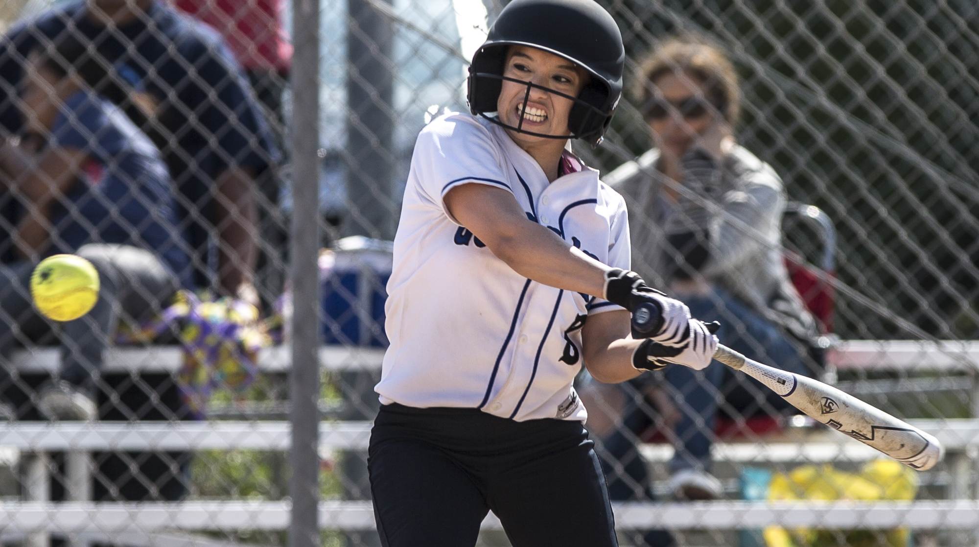 Santa Monica College Corsair freshman batter Ashley Nava prepares to nail a powerful curveball thrown by Cuesta College Cougar pitcher sophomore Taylor Rasmusson at the John Adams Middle School field in Santa Monica California, on Tuesday, April 3 2018. The Santa Monica Corsairs lost 6-5 against the Cuesta College Cougars in the ten-inning softball game. (Matthew Martin/Corsair Photo)