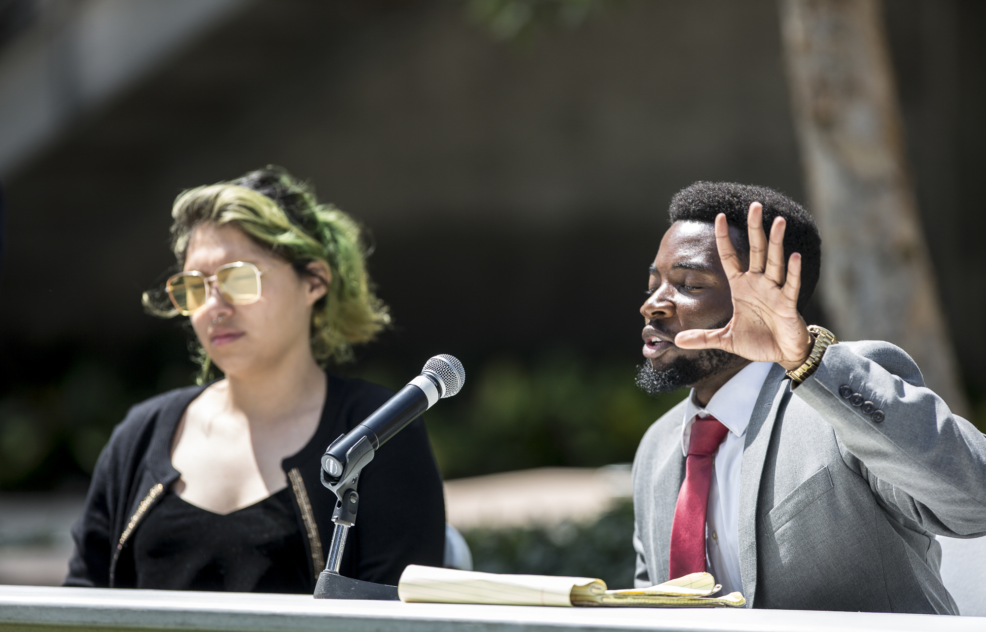  Santa Monica College Associate Student (A.S) Director of Student Advocacy candidates Alexa Benavente (left) and Gosple Ofoegbu (right) take questions from those in attendance during the A.S election debate on the quad of the Santa Monica College mai